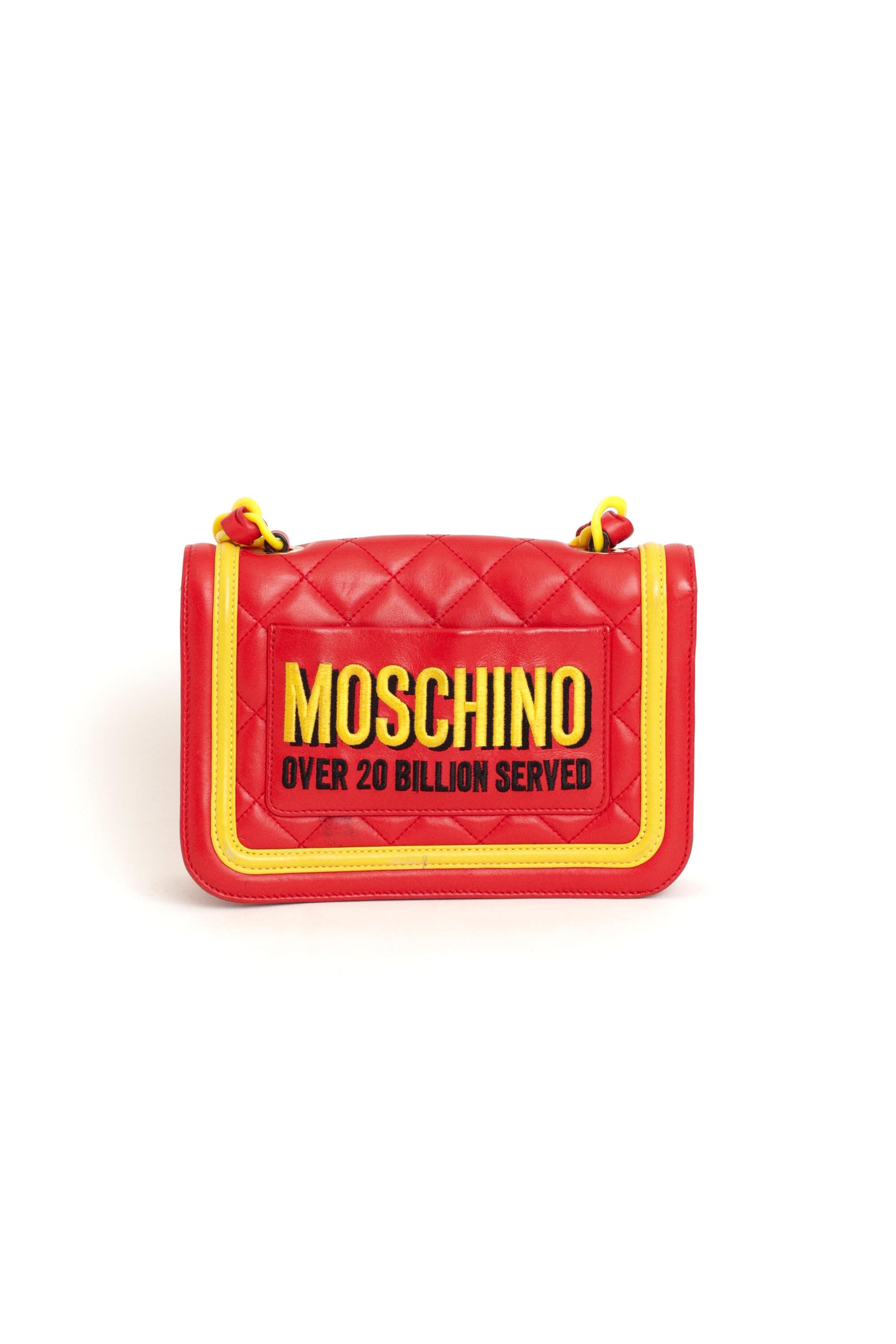 Nordic Poetry is excited to present this incredibly iconic Moschino Fall Winter 2014 McDonald's red leather crossbody bag, from The FastFood Collection by Jeremy Scott. Features chain strap, two inside compartments, inside zip back pocket and an