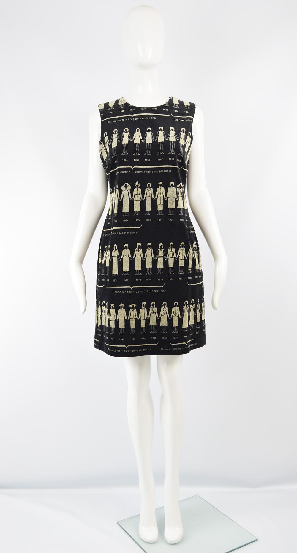 An incredible and rare vintage women's shift dress from the 90s by Moschino. In a black velvet with an amazing print of fashion history, featuring designs from 1923 to 1997, with iconic Moschino designed dresses and suits from 1983 to 1997, the