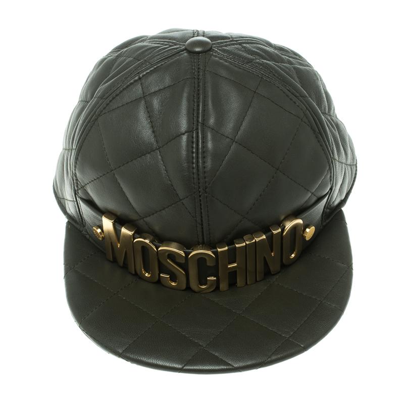 Everybody wants to own a cap as gorgeous as this one from Moschino! It has been crafted from quilted leather and decorated with the brand's lettering in gold tone. The label is flaunted beautifully, and the interplay of the gold metal with the