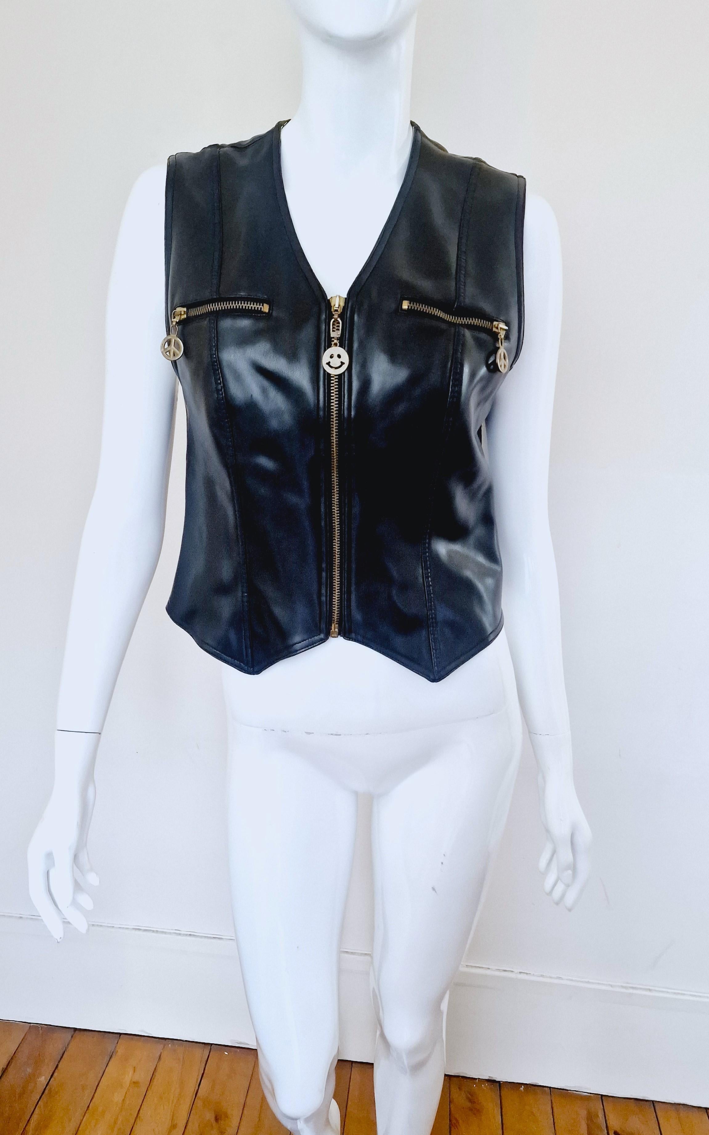 Faux leather biker vest by Moschino! 
Moschino peace and smiley buttons.
2 front pockets.
Bella Hadid worn a similar Moschino piece and shared the photos on her Instagram in 2020. 

VERY GOOD condition! Outside: like new. Inside: modarate sign of
