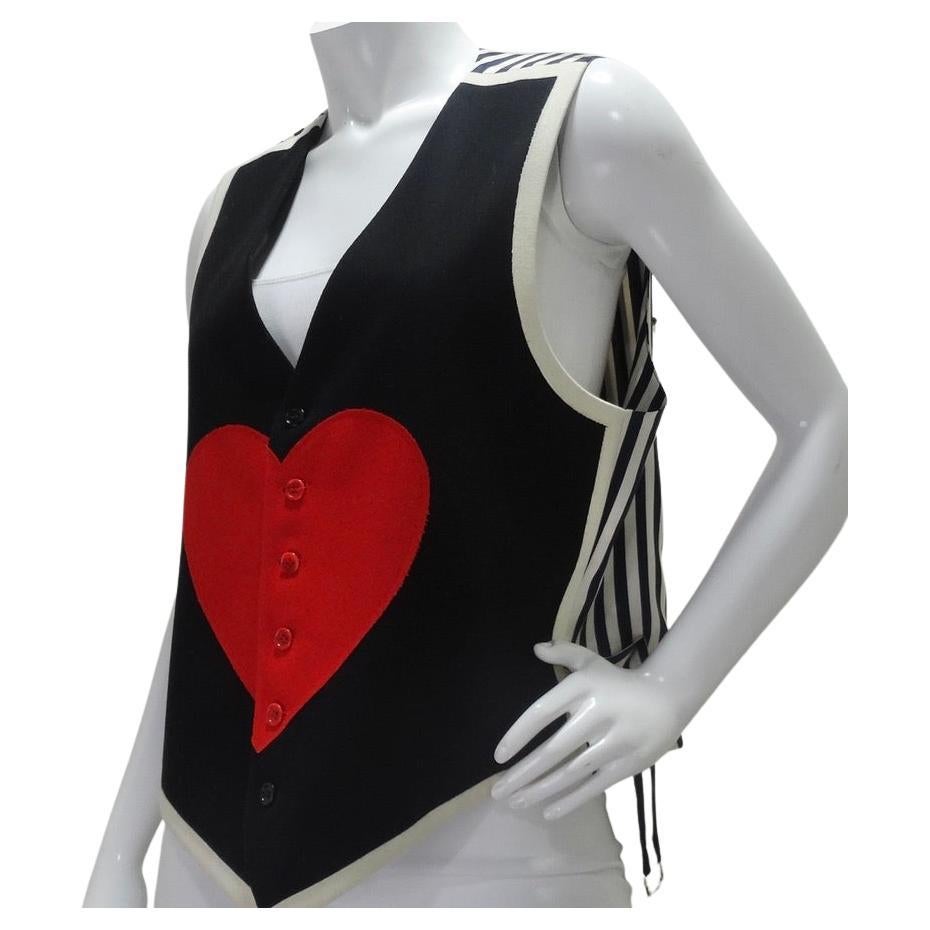 Super fun button down wool vest from Moschino's 'Cheap and Chic' line circa 1990s! The large heart motif in the center of the vest is the star of the show and is so fun to play around with unbuttoning! The back of the vest creates a contrast with a