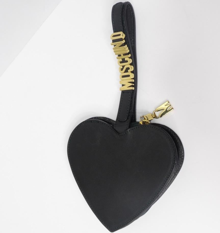 This heart shaped Moschino wristlet is going to have you head over heels in LOVE! A dark green leather with dark green stitching is complimented by gold 'Moschino' logo hardware on the strap. The top unzips to reveal a small opening ideal for