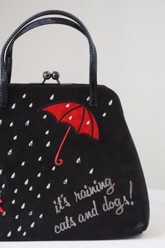 Moschino "it's raining cats and dogs" Handle bag