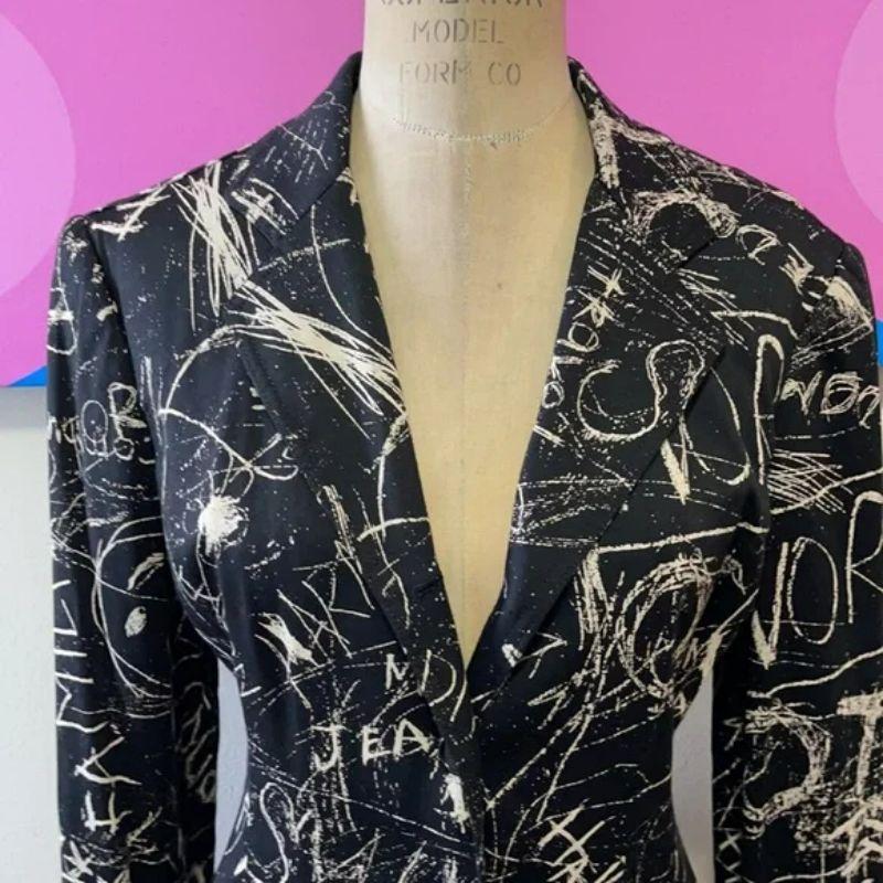 Moschino jeans black cream graffiti blazer

Be retro cool wearing this graffiti blazer from Moschino Jeans line! Pair with black skinny jeans and boots for a finished look.

Size 6
Across chest - 17 1/2 in.
Across waist - 15 1/2 in.
Shoulder to hem