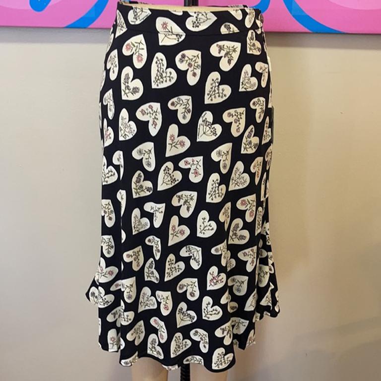 Moschino black heart floral full summer skirt NWT

Summer dressing is easy and fun wearing vintage Moschino! This cute skirt is light weight and has fun hearts with flowers inside! Pair with simple tank top and wedges for a finished look. New and