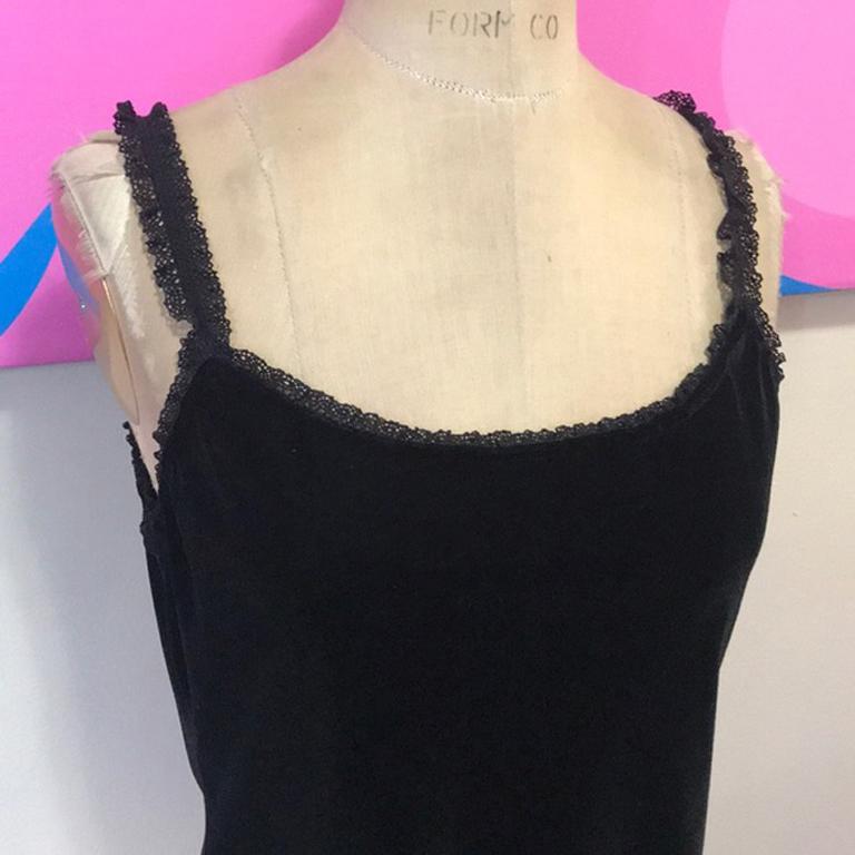 Moschino jeans black stretch velvet top nwt

It's have to find vintage Moschino with tags, but it's out there and we have this very wearable stretch velvet camisole style top! Tiny ruffle trim on the front and shoulder straps. Perfect for evenings