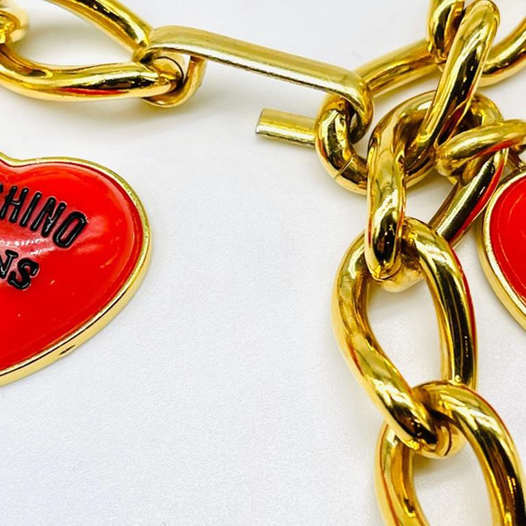 Moschino jeans gold chaim charm belt vintage

This vintage belt from Moschino Jeans line is really fun and perfect for summer dressing. Charms are metal and enamel and plastic and feature : cows, hearts, peace sign, smiley face,There are three peace