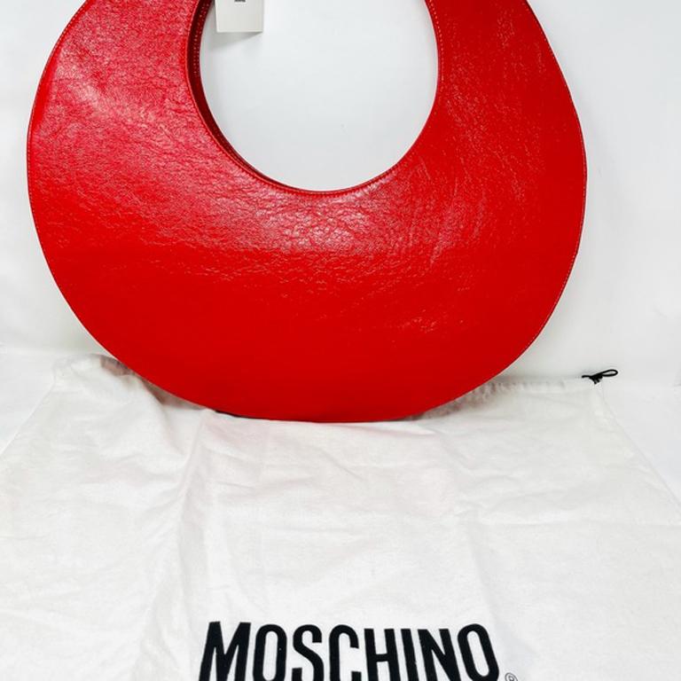 Moschino jeans red patent leather circle bag nwt

This vintage Moschino Circle bag is highly collectible and the perfect retro piece to add to your wardrobe. It is oversized style and design. New and never used. Has original brand tag and dust bag.