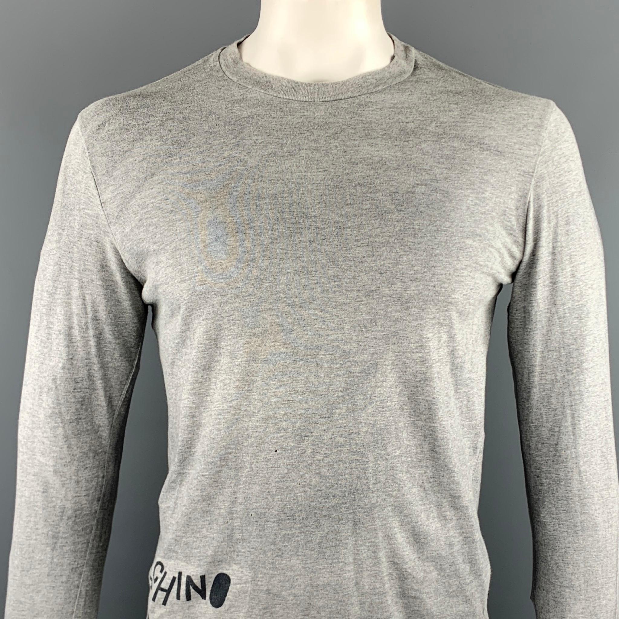 Vintage MOSCHINO JEANS long sleeve t-shirt comes in a gray cotton featuring front & back graphic details and a crew-neck. Minor discoloration. As-Is. Made in Italy.

Very Good Pre-Owned Condition.
Marked: L

Measurements:

Shoulder: 18 in. 
Chest: