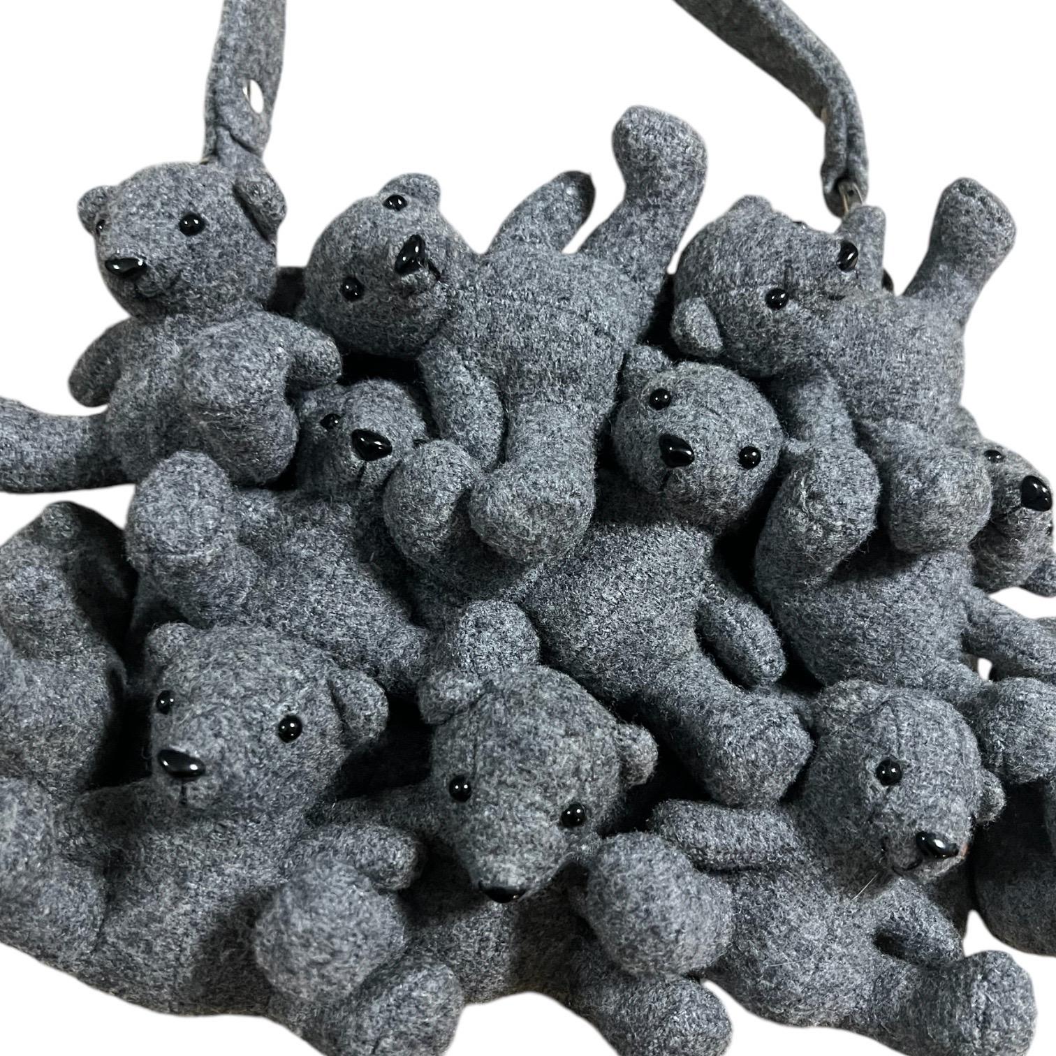Whimsical Moschino Jeans vintage gray wool teddy bear bag.
One interior zip pocket.

Condition: Excellent condition with no visible flaws.

