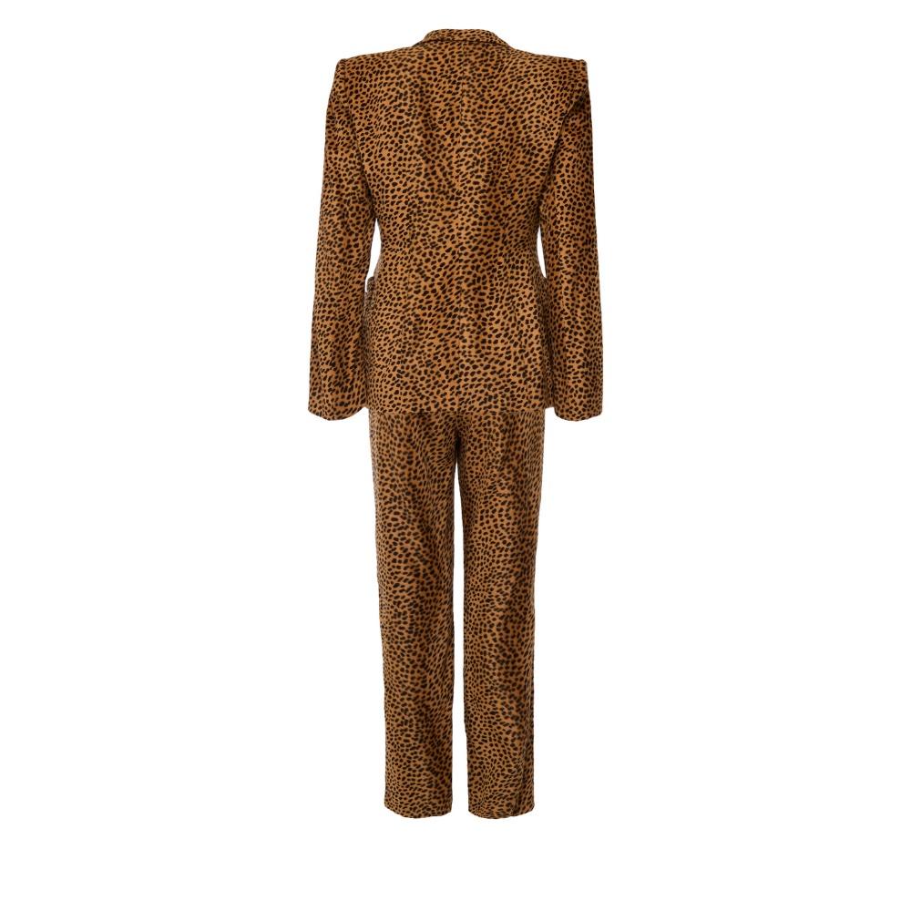 Step out in bold style with this Moschino Leopard Print Suit, a statement piece that exudes fun and high-fashion. Featuring the iconic leopard print, this suit captures the essence of Moschino's playful yet elegant design, making it perfect for