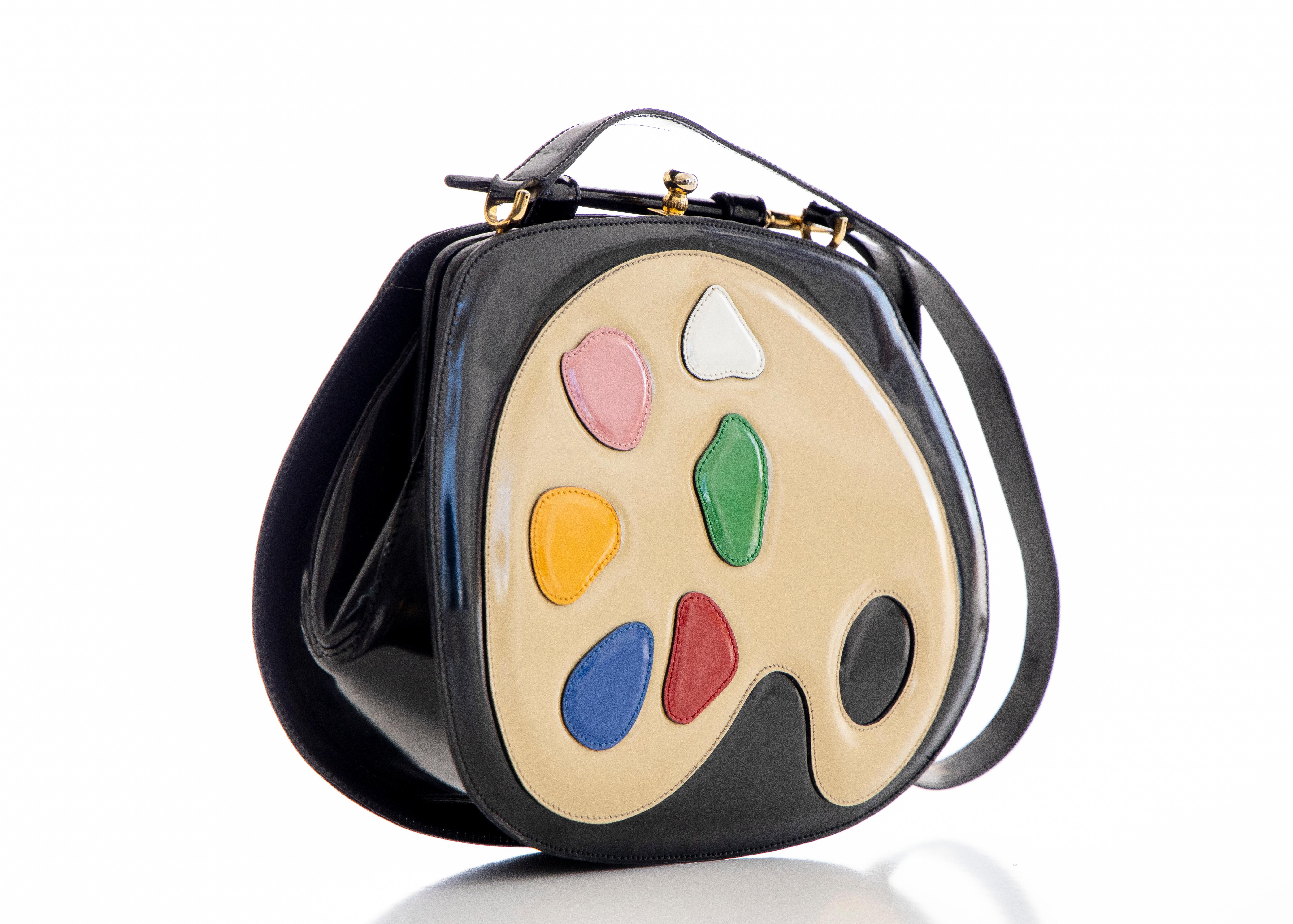 Moschino made by Redwall limited edition black patent leather artist's palette shoulder bag with gold-tone hardware, multicolor leather at front face, single flat shoulder strap, removable paintbrush adornment at top, tonal jacquard lining, single