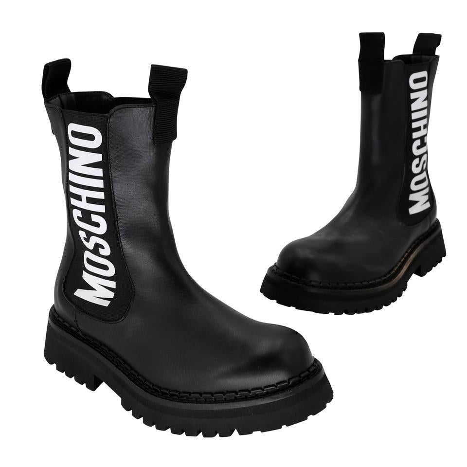 Evoking the look of a chelsea boot with elasticized sides and a bold logo, this short pair by Moschino is crafted of smooth calf leather.

Item Specs:
Made in SPAIN
Stamped Size 37 fits size US 7
Heel Height:Low 1