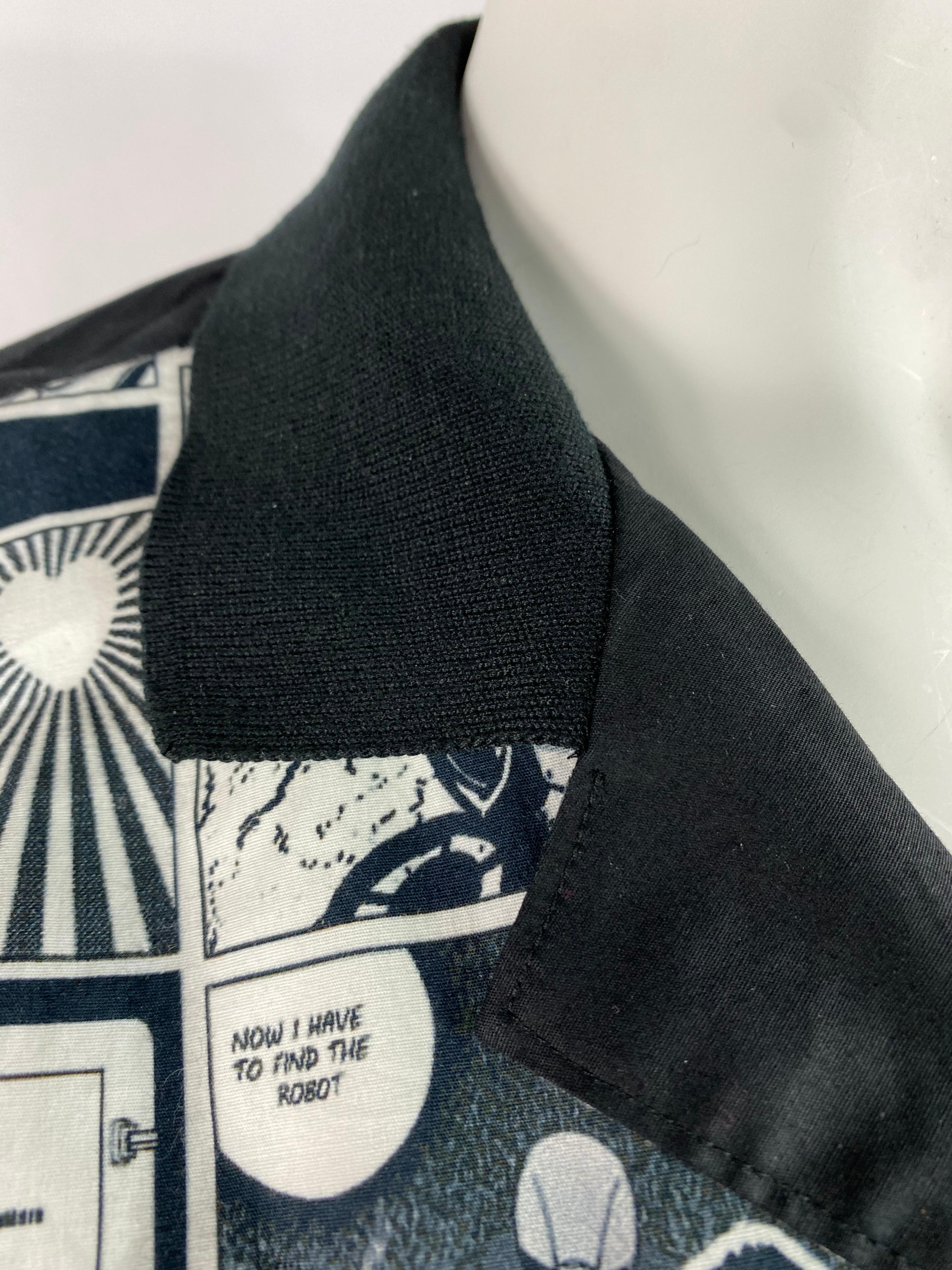 Product details:

The shirt is designed by Moschino Love, it features black, white and grey Japanese comics print on the front, collar, short sleeves and button down closure.