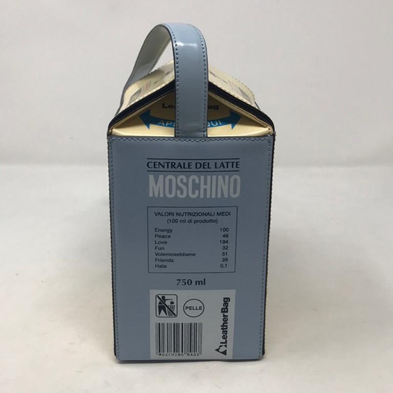 Moschino milk carton leather shoulder bag

Museum quality Moschino milk carton bag made of leather. Bends in Leather handle strap from improper storage. A few black marks in bottom AND one dot on one side otherwise fantastic vintage condition. 
Snap