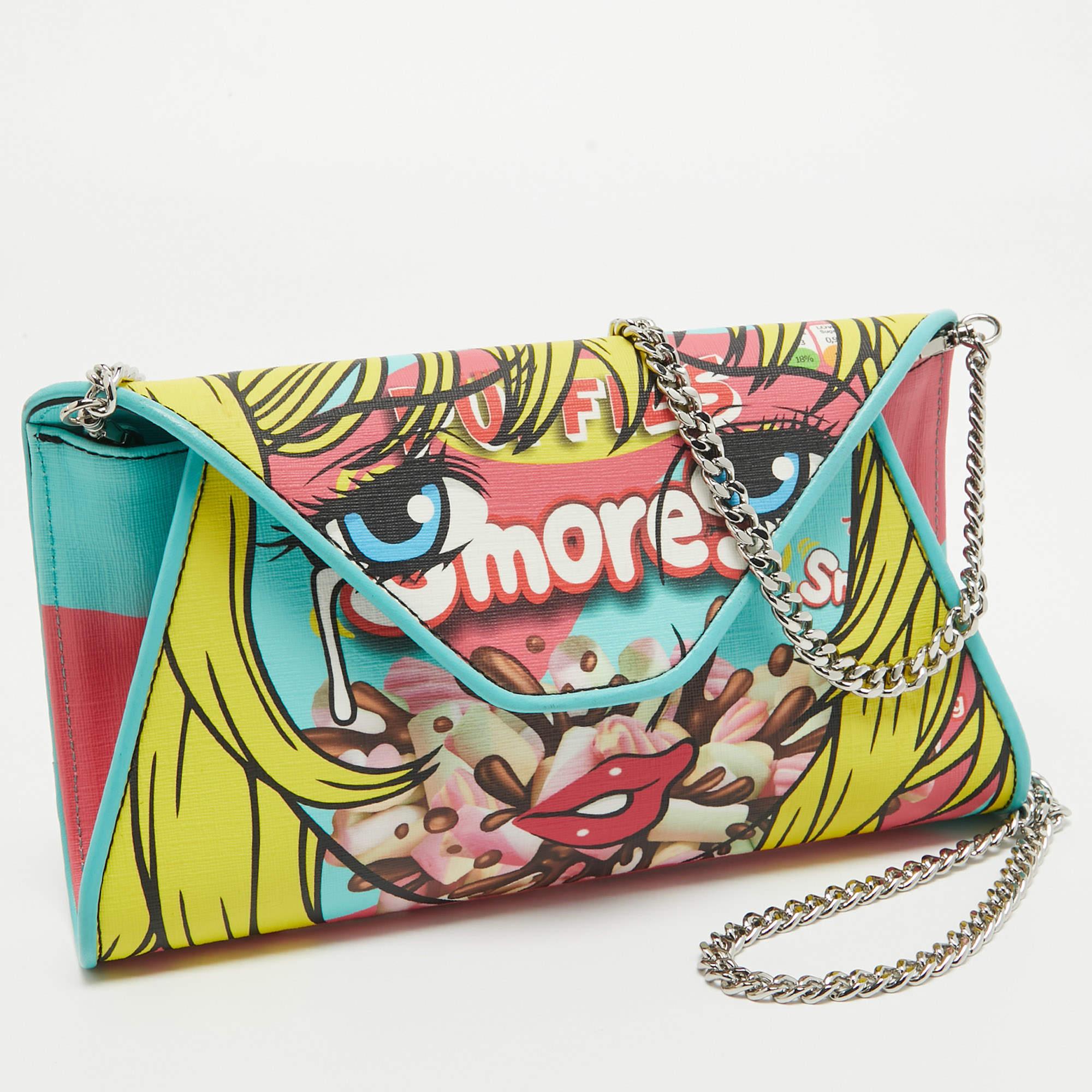 This lovely clutch by Moschino carries a fun design. It is crafted using canvas & leather with color prints on the exterior. It comes with a chain.


