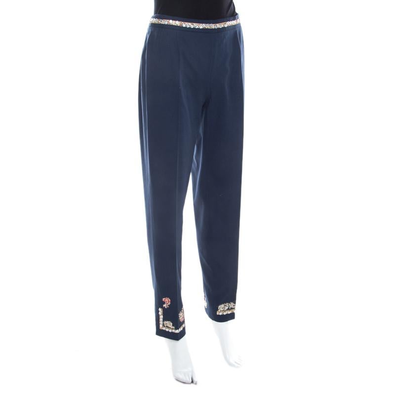 These trousers from Moschino are so well-tailored, you'll love flaunting them everywhere. It is made of the finest cotton and comes flaunting a navy blue shade. The trousers have pretty embroidered detail at the waistline and at the hem. They will