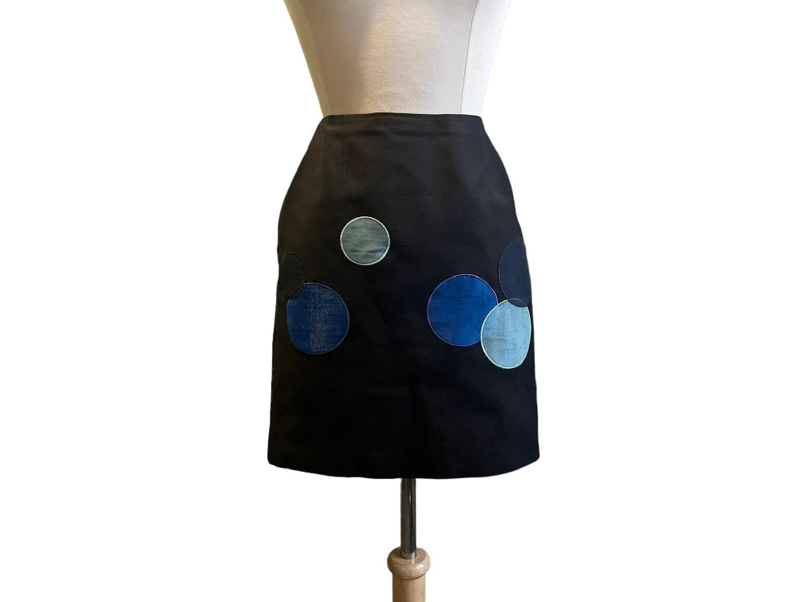 Moschino navy blue cotton pique mini skirt. straight silhouette. large scale dots in three shades of blue in appliquéd organza on the front and back of skirt. side zip closure. skirt is lined.

✩ This skirt is a rare find! It's the blue version of
