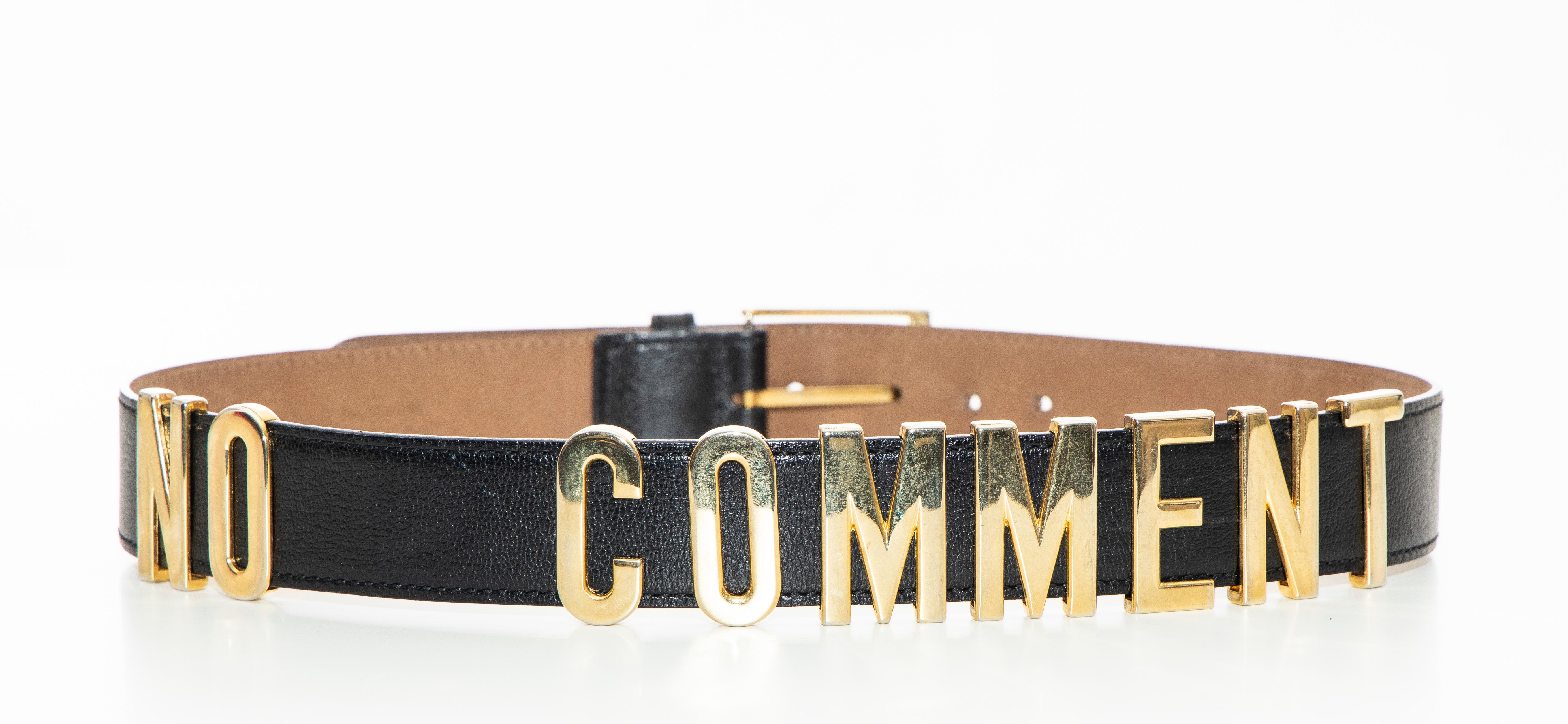 Moschino, Circa: 1990's black redwall leather belt with gold-tone hardware, 'No Comment' at exterior and buckle closure.

Length Min: 27