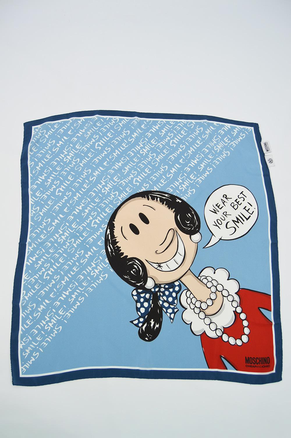 Size: Width - 25” / 63cm x Length  - 25” / 63cm

A fabulous and highly collectible women's silk scarf by luxury Italian fashion house, Moschino. Made in Italy, in a printed blue silk with hand rolled edges and a fun 'Olive Oyl' print from Popeye the