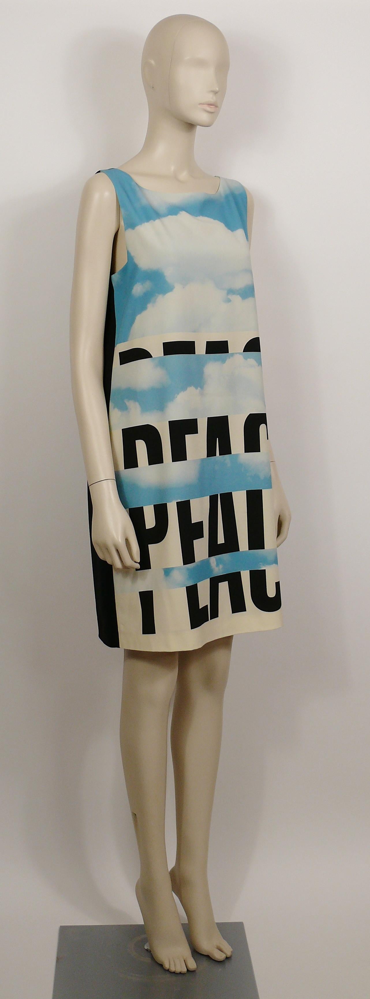 MOSCHINO light blue, off-white and black PEACE cloud print dress featuring a boat neck, a sleeveless design and a plain black back.

Slips on.
Back zippered closure.
Fully lined.

Label reads MOSCHINO Cheap and Chic.

Size tag reads : I 44 / D 40 /