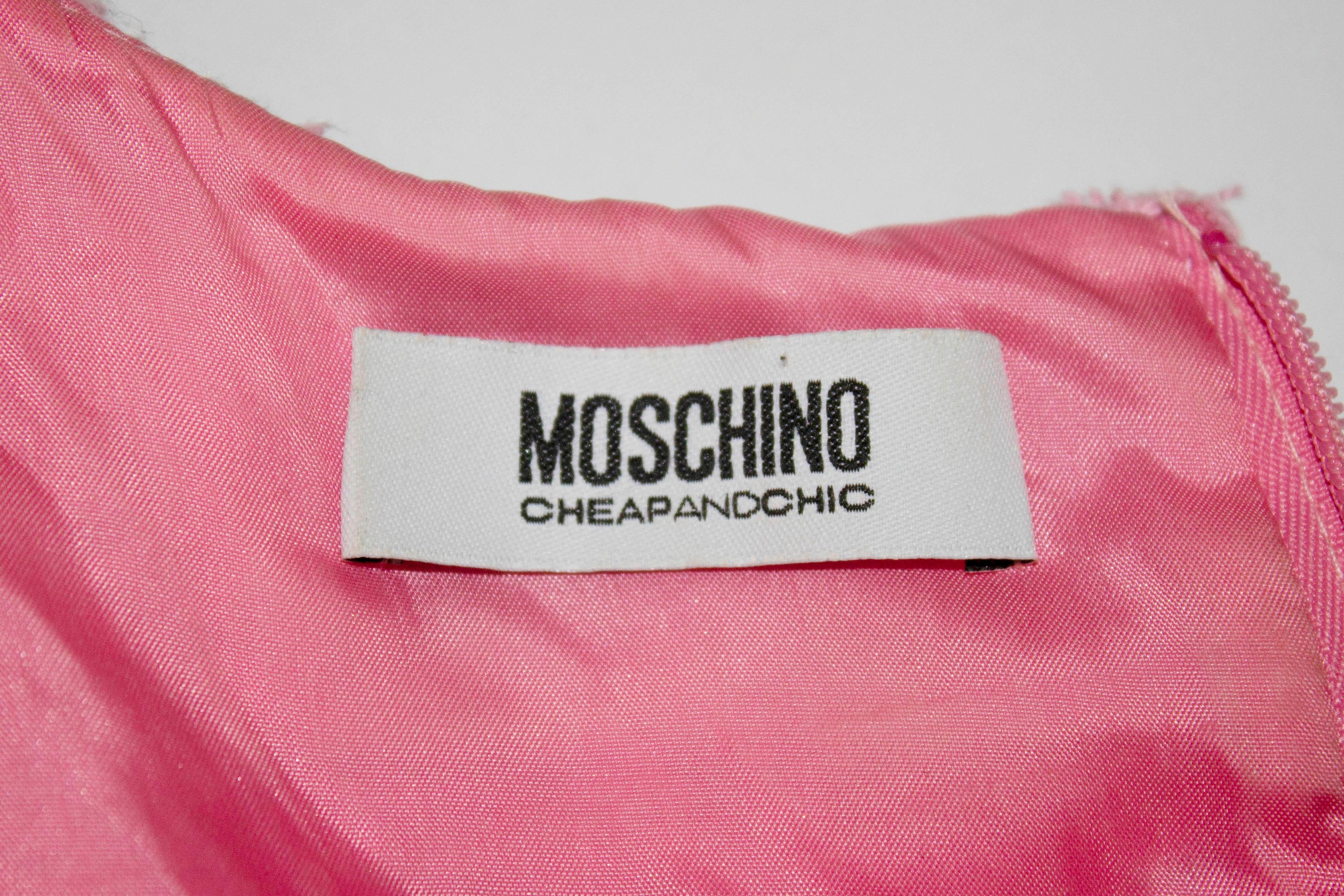 A pretty pink shift dress by Moschino , Cheap and Chic. In a pink cotton mix fabric the dress has animal print detail around the neckline , and central back zip and is fully lined.

Size GB 6 /  USA 4 , Bust 37'', length 34 '' plus 2'' hem.
