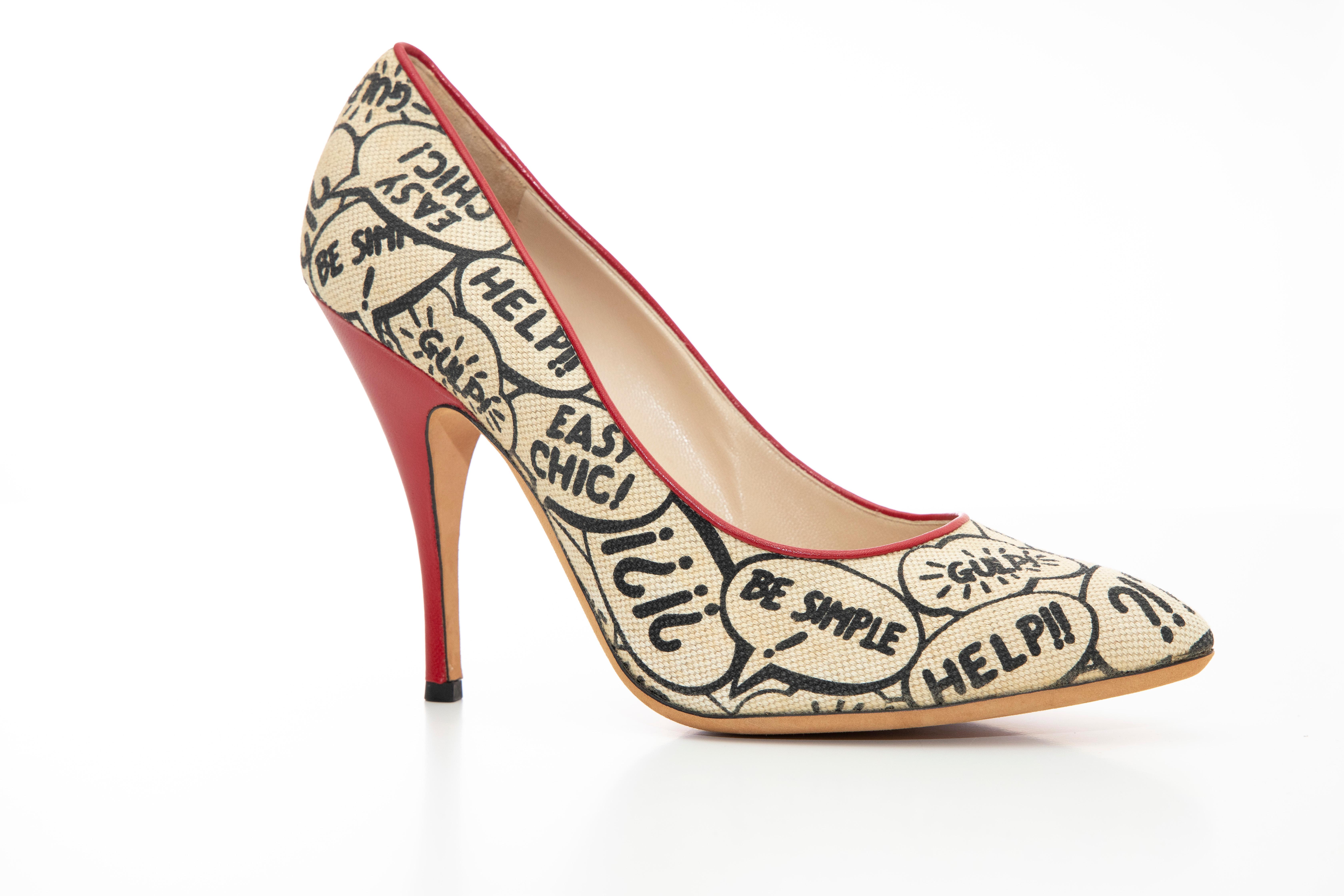 Moschino, Circa: 1993  printed stiletto with red leather heels and trim.

EU. 41
US. 11

Heel: 4.5