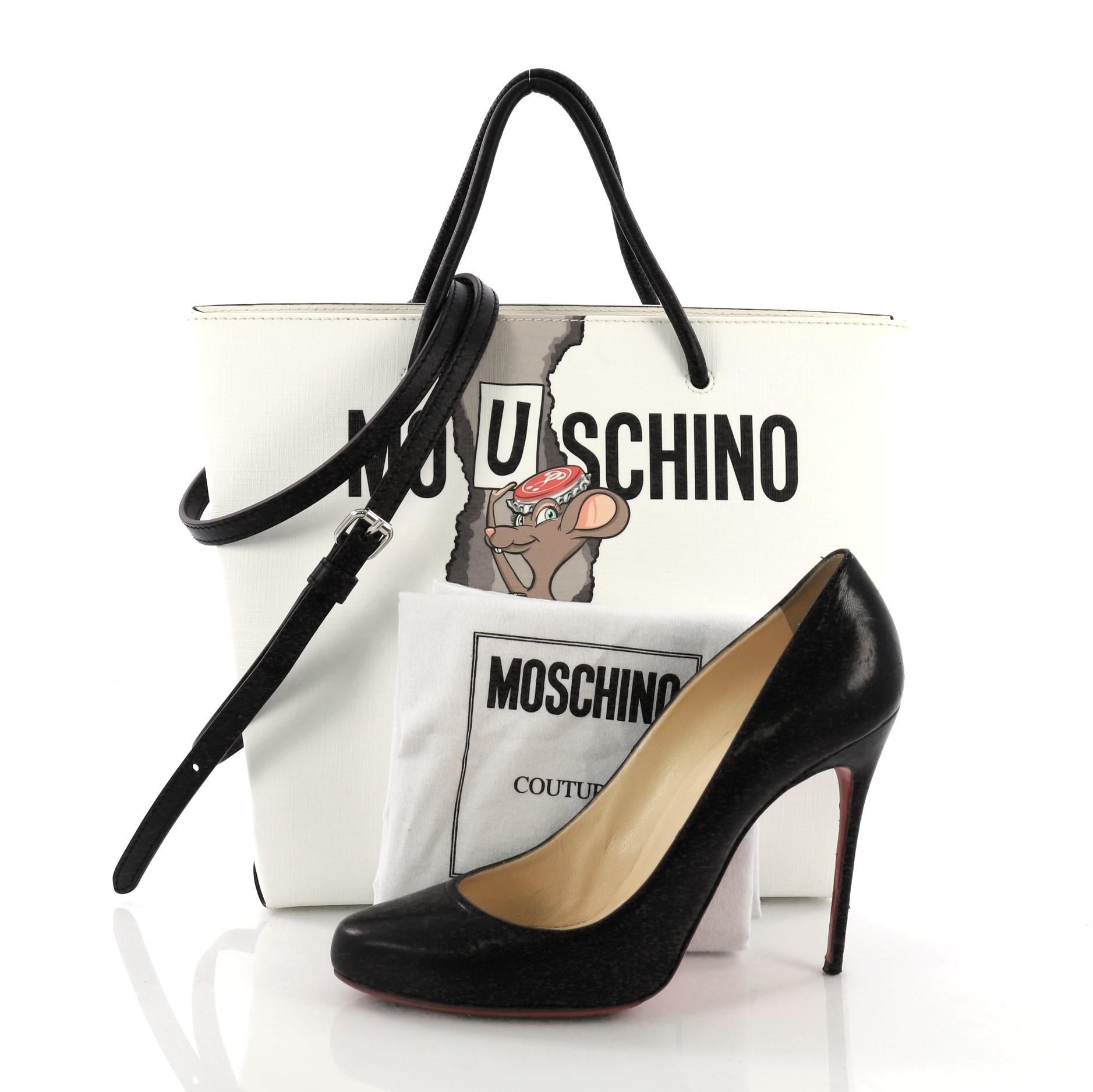 This Moschino Rat-a-Porter Tote Printed PVC, crafted in white printed pvc, features 