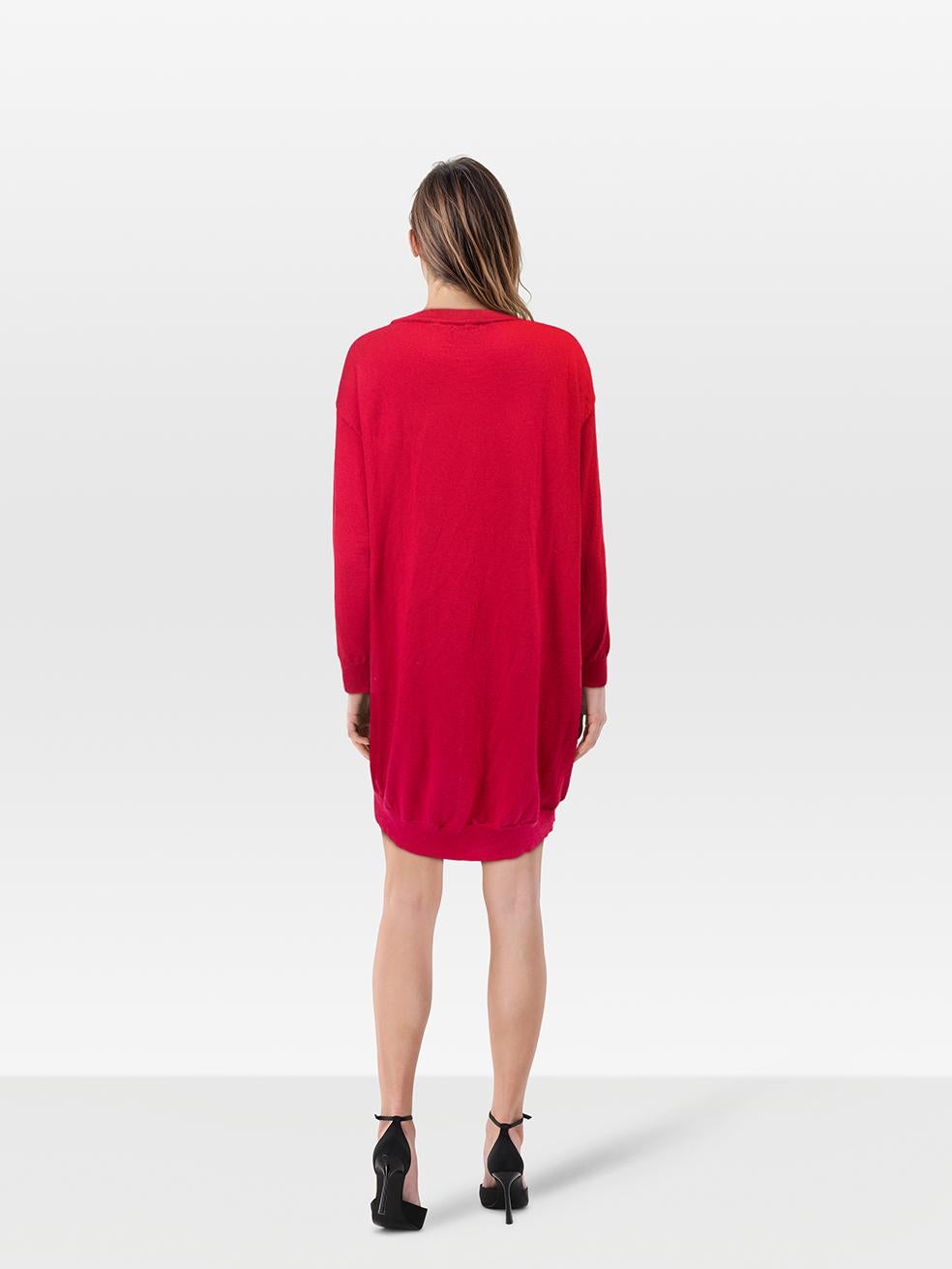 CONDITION is Very Good. Hardly any visible wear to the dress is evident on this used Moschino designer resale item.
 
 
 
 Details
 
 
 Red
 
 Wool
 
 Knit dress
 
 Long sleeves
 
 Knee length
 
 Star knit pattern
 
 Round neck
 
 
 
 Made in Italy
