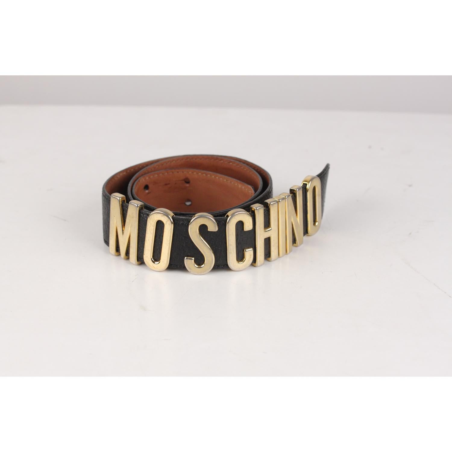 - Stunning vintage lettered belt by Moschino, one of their most famous pieces this is a must have for any true fashionista!
- Black leather belt
- Gold-tone metal signature letters
- Gold letters apart from The M at the start and the O at the end