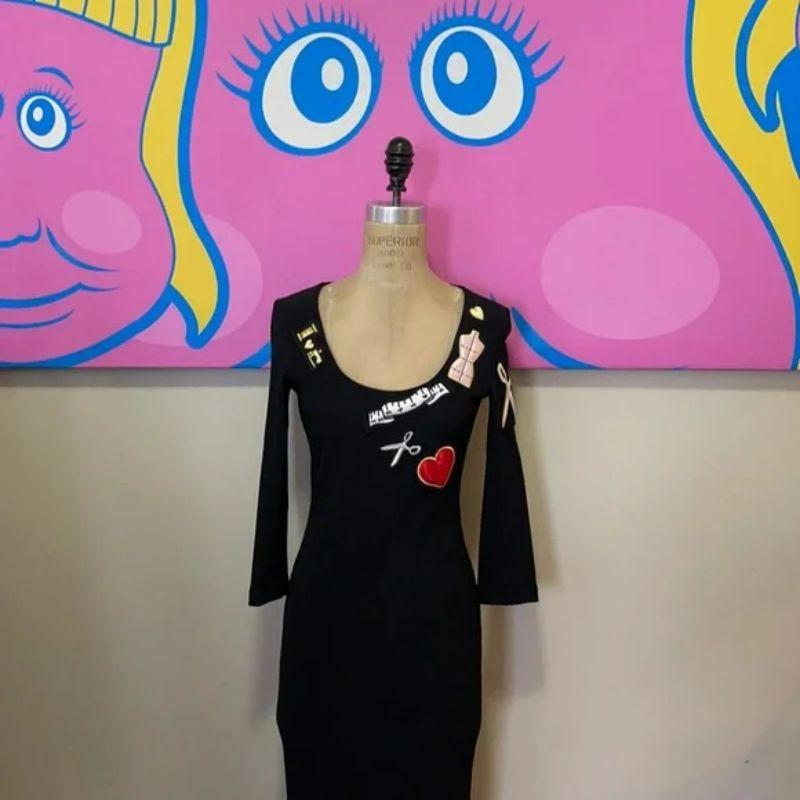 Moschino sewing black sheath dress scissors heart

This Moschino Cheap and Chic rib knit dress is a real show stopper! The fun sewing themed patches make this a stand out. Pair with nude or black heels for date night!

Size 6
Across chest - 16