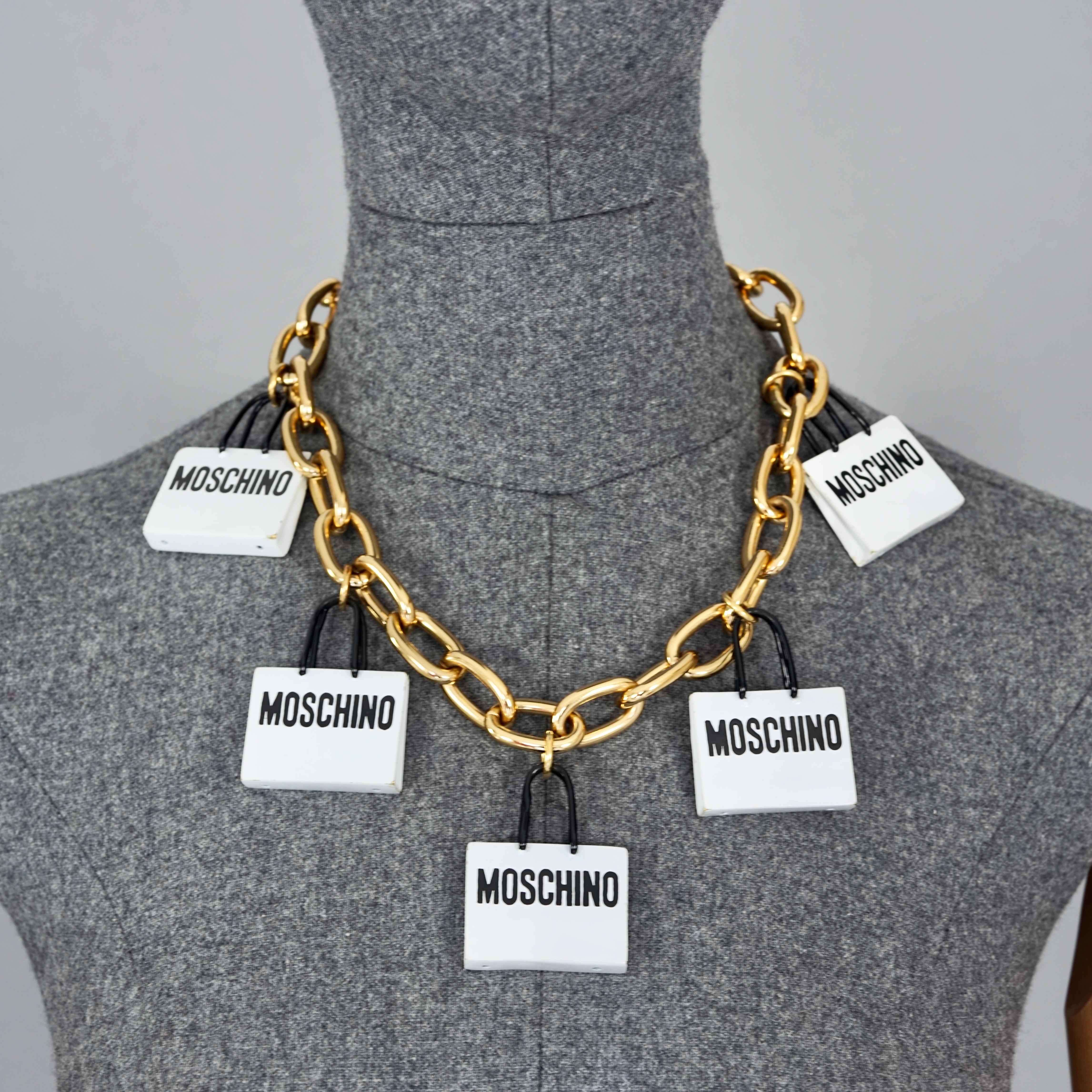 MOSCHINO Shopping Bag Charm Novelty Necklace Resort 2016 Runway

Measurements: 
Height Drop: 2.36 inches (6 cm)
Bags: 1.57 inches X 1.18 inches (4 cm X 3 cm)
Wearable Length: 19.68 inches (50 cm)

Features:
- 100% Authentic MOSCHINO COUTURE.
- Chain