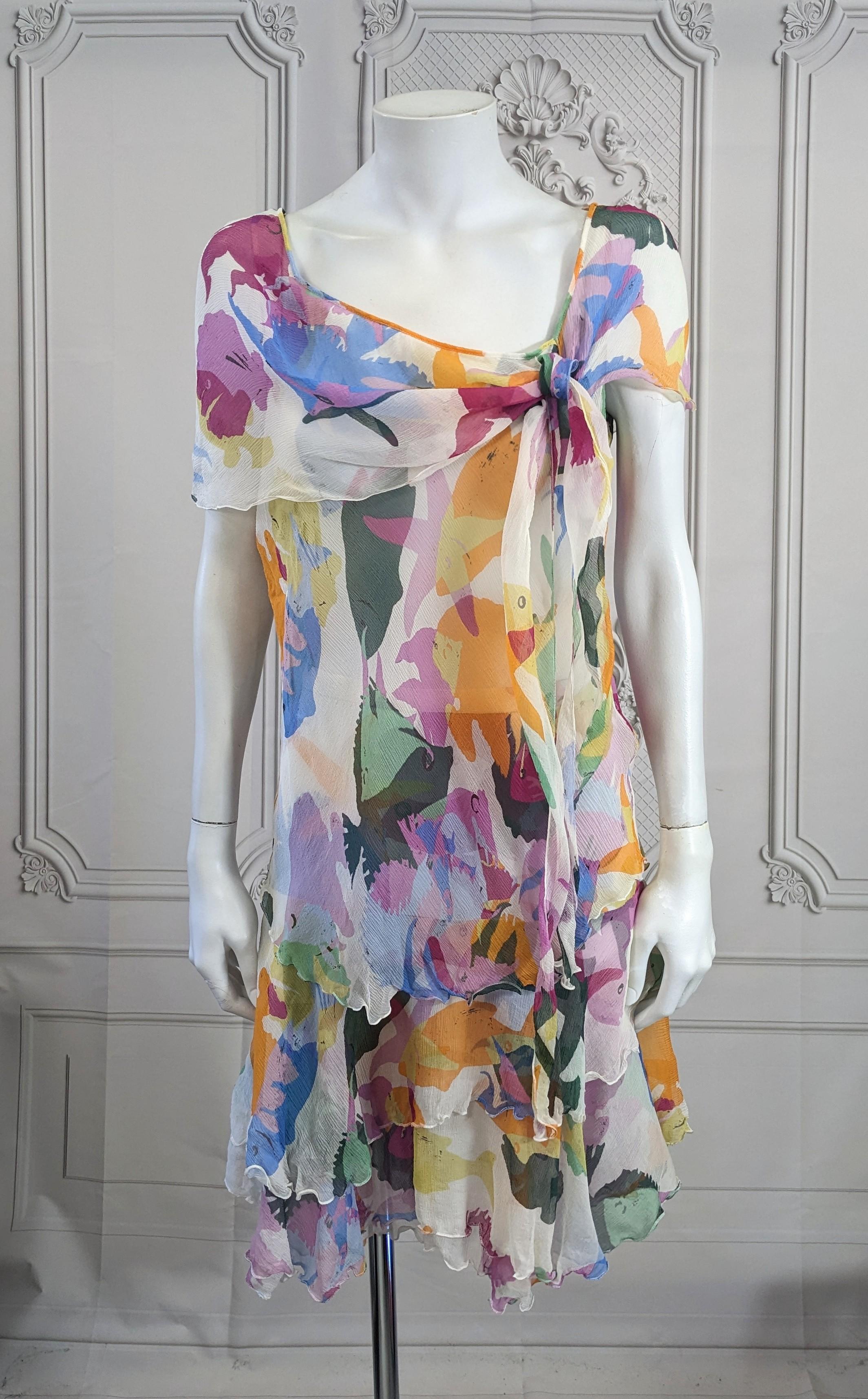 Moschino Silk Chiffon Aquatic Print Set from the early 2000's. Silk chiffon top with side tied capelet with triple tiered skirt. Shown with top over skirt but can be worn tucked in as well. 
size 4, Italy. 