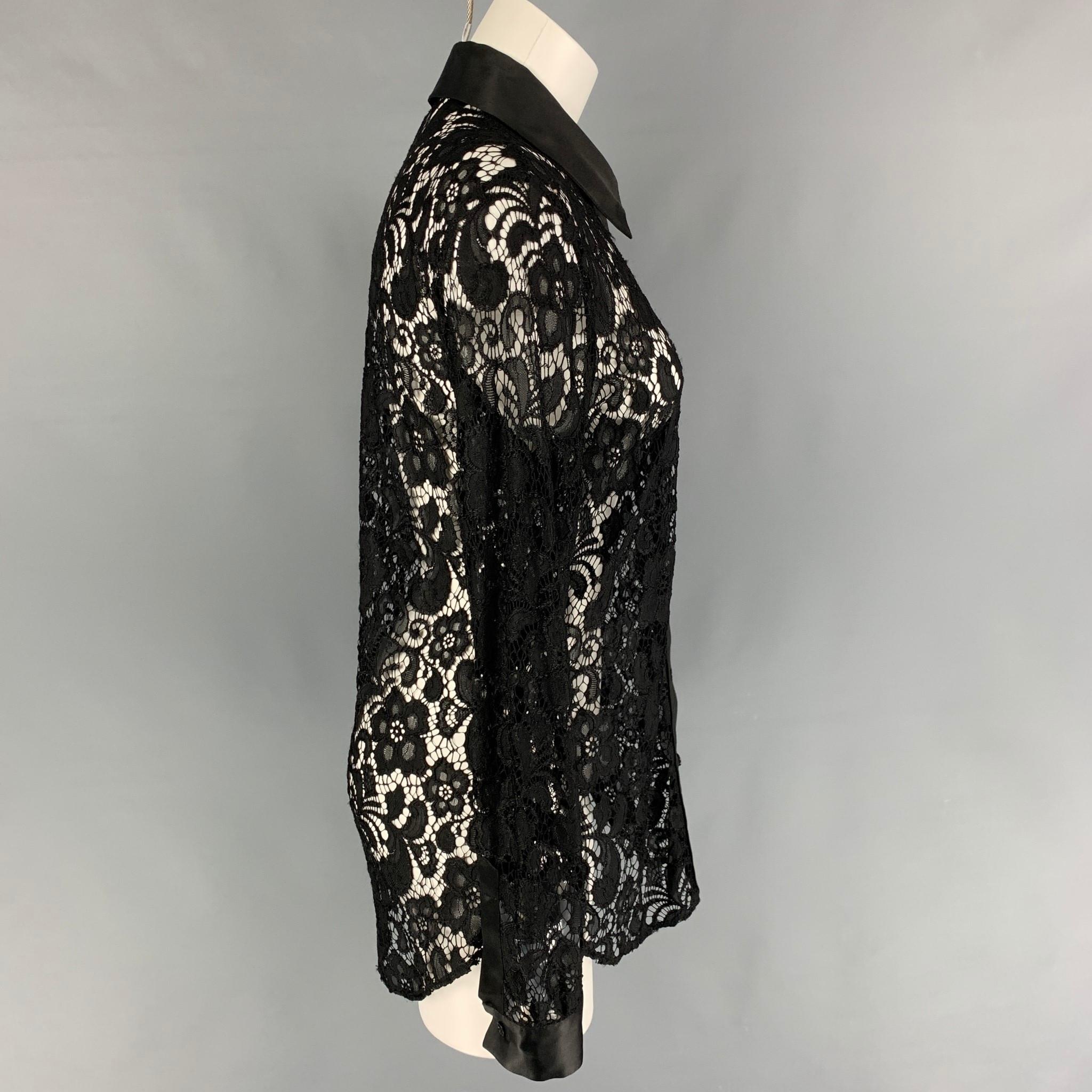 MOSCHINO shirt comes in a black lace polyamide featuring a spread collar and a button up closure. 

Very Good Pre-Owned Condition.
Marked: I 44 / D 40 / F 40 / GB 12 / USA 10

Measurements:

Shoulder: 16.5 in.
Bust: 36 in.
Sleeve: 27 in.
Length: