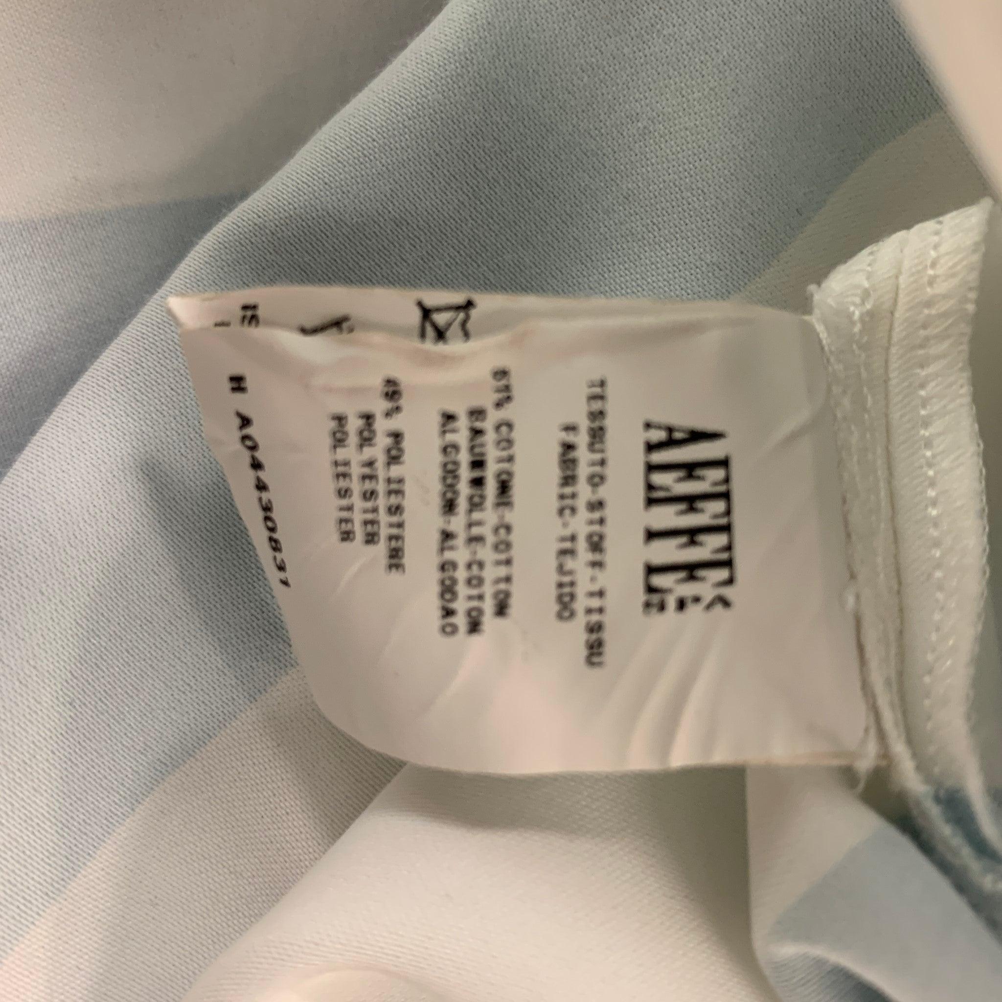 MOSCHINO - Robe sans manches à rayures en coton et polyester bleu clair et blanc, taille 4 en vente 1