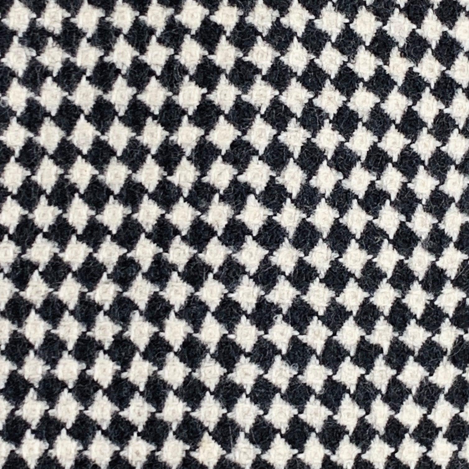 Vintage CHEAP AND CHIC by MOSCHINO sport coat
in a black and white wool featuring a checkered pattern, notch lapel, double vented back, and three button closure.Excellent Pre-Owned Condition. 

Marked:   IT 52 

Measurements: 
 
Shoulder: 18.5