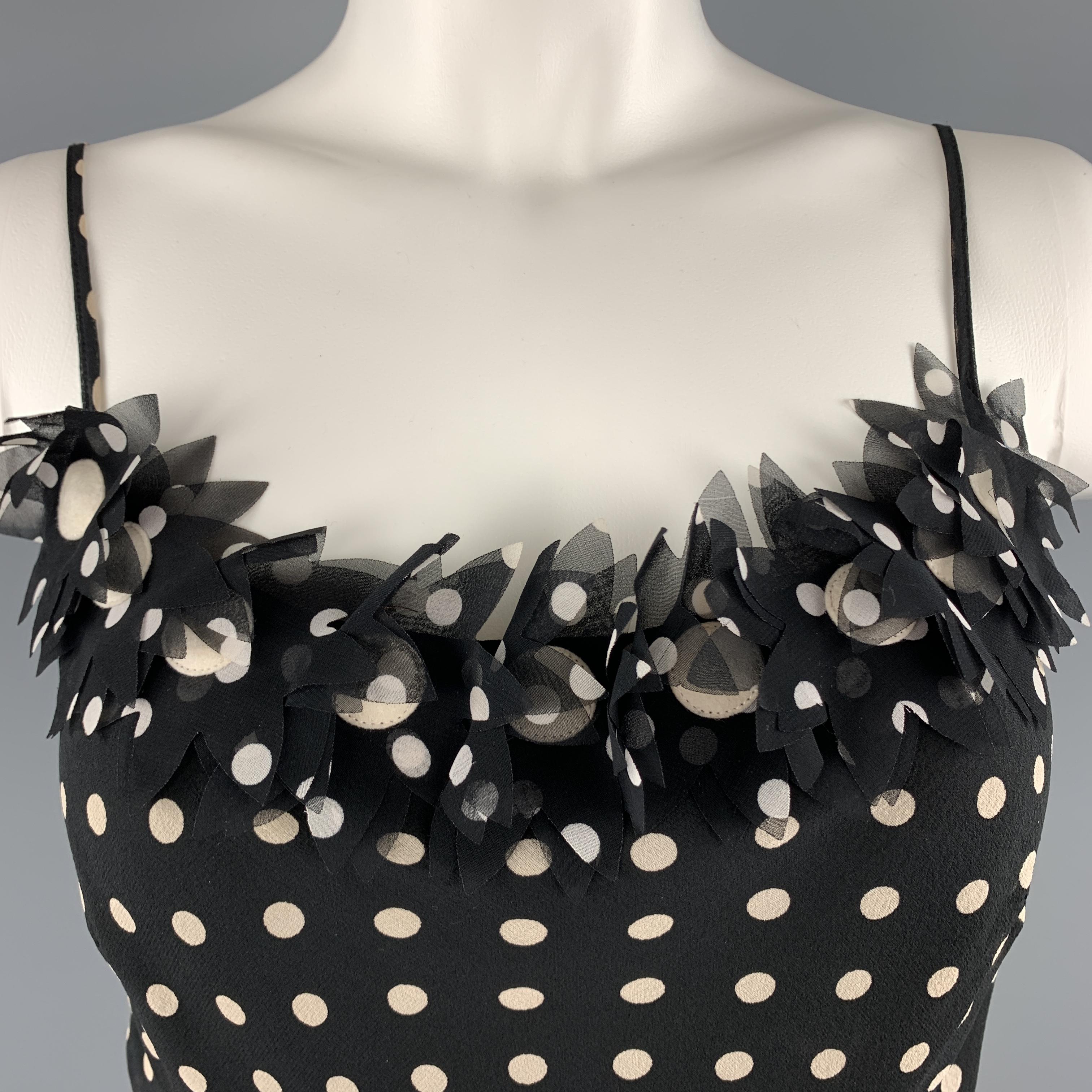 MOSCHINO CHEAP AND CHIC camisole comes in black and cream polka dot silk with skinny straps and floral appliques. Cardigan jacket available separately. Made in Italy.

Excellent Pre-Owned Condition.
Marked: 6

Measurements:

Shoulder: 11 in.
Bust: