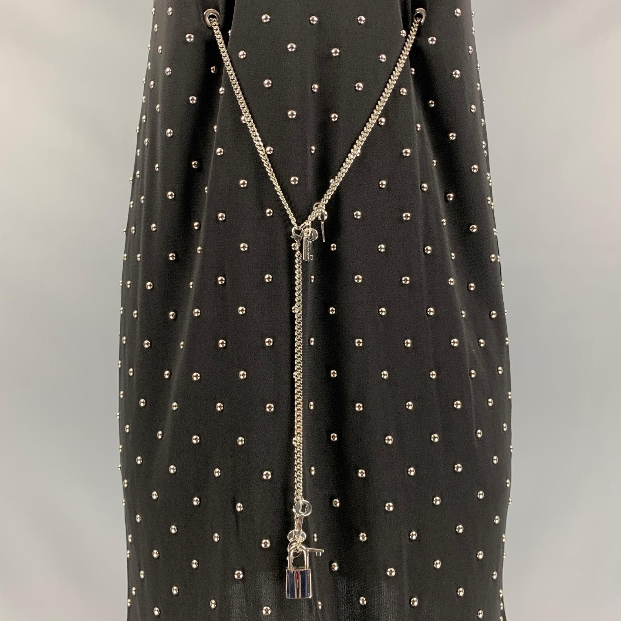 MOSCHINO cheap and chic sleeveless below knee dress comes in a black polyester, full lined featuring studded detail and metal belt. Made in Italy.
Excellent Pre-Owned Condition.  

Marked:   40 IT 

Measurements: 
 
Shoulder: 13 inBust: 36 inWaist: