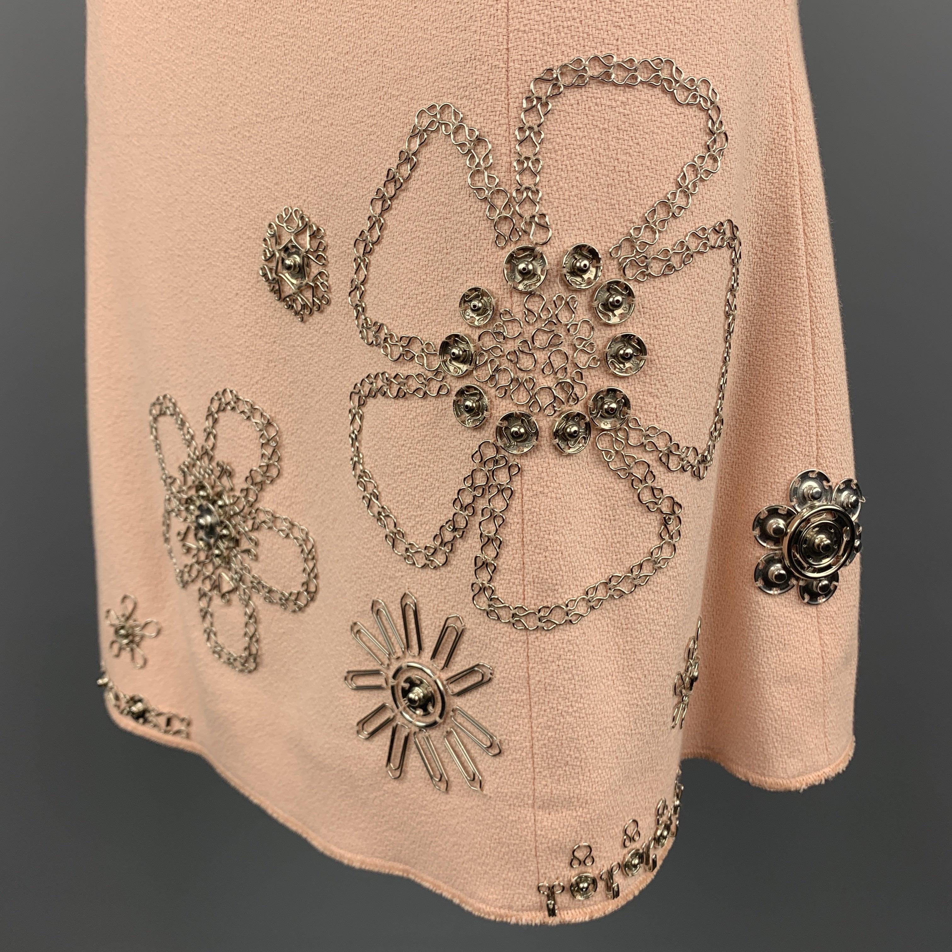 MOSCHINO A-line Skirt comes in a rose tone in a textured cotton material, with silver tone metal hook & eye, press buttons and staples embellishments. Made in Italy. 
Excellent Pre-Owned Condition.
 

Marked:   6
 

Measurements: 
  
lWaist: 26