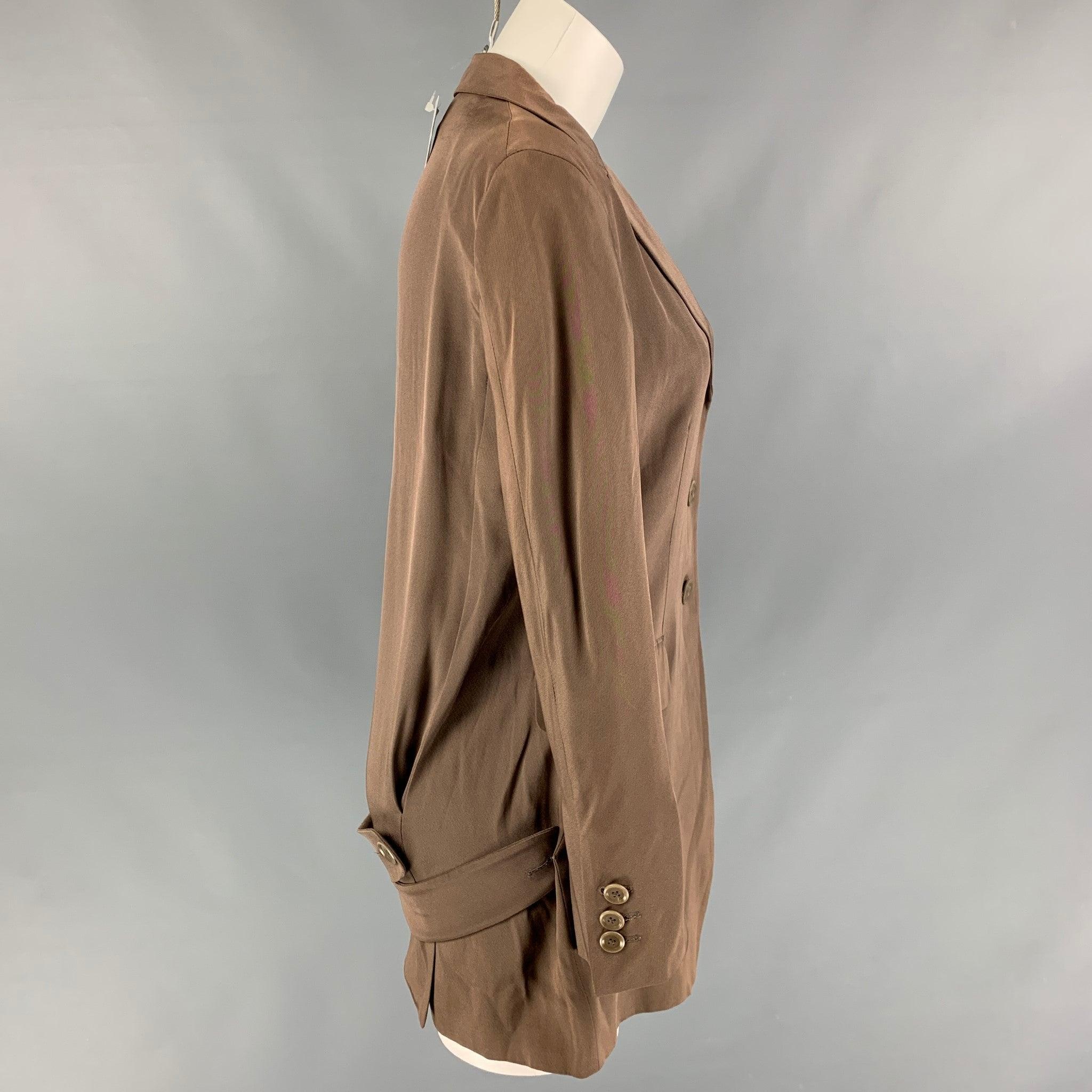 MOSCHINO blazer comes in taupe acetate blend fabric featuring notch lapel, single breast three button closure, two frontal pockets with gore, and double belt at back. Made in Italy.New With Tags 

Marked:   8 

Measurements: 
 
Shoulder: 16.5 inches