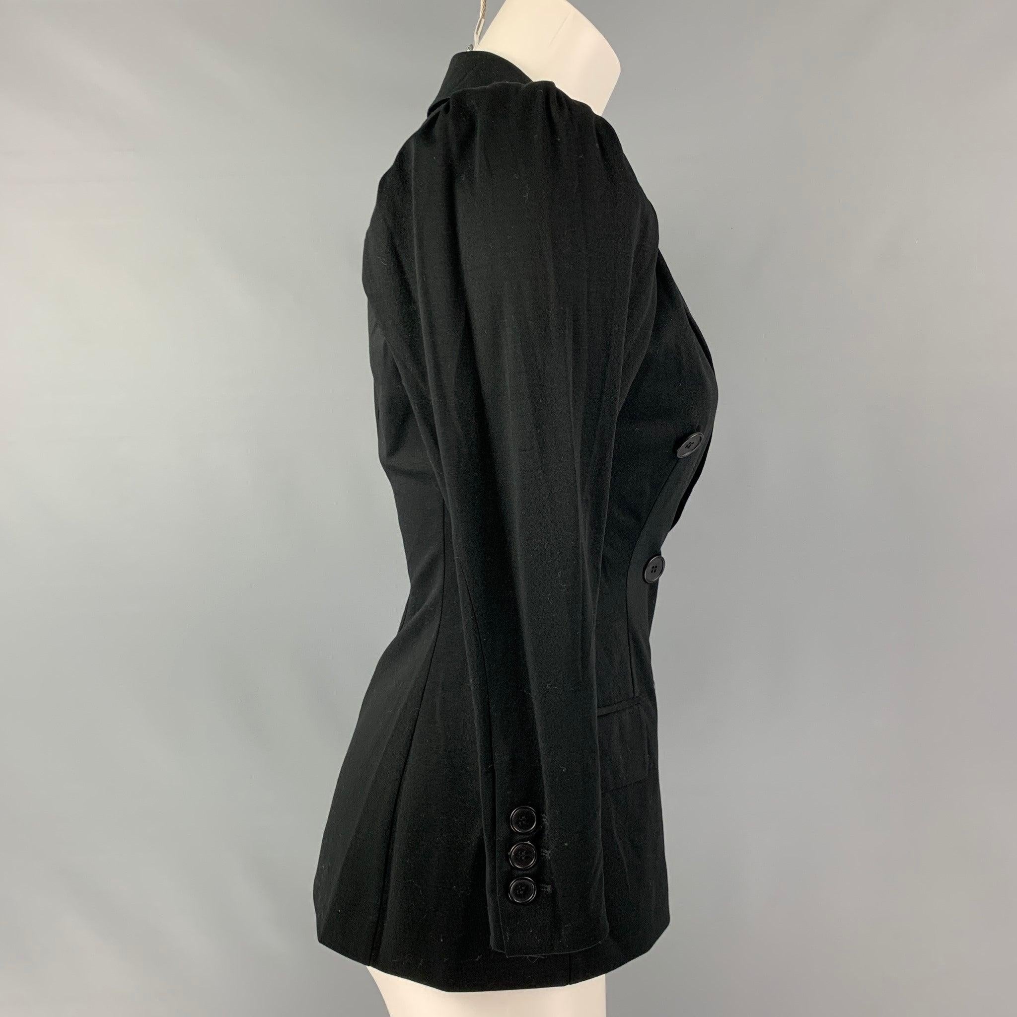 MOSCHINO double breasted jacket comes in a black cotton and polyester knit jersey featuring a notch lapel, flap pockets, pleated shoulder and button closure.Very Good Pre-Owned Condition. 

Marked:   8 

Measurements: 
 
Shoulder: 17.5 inches Bust: