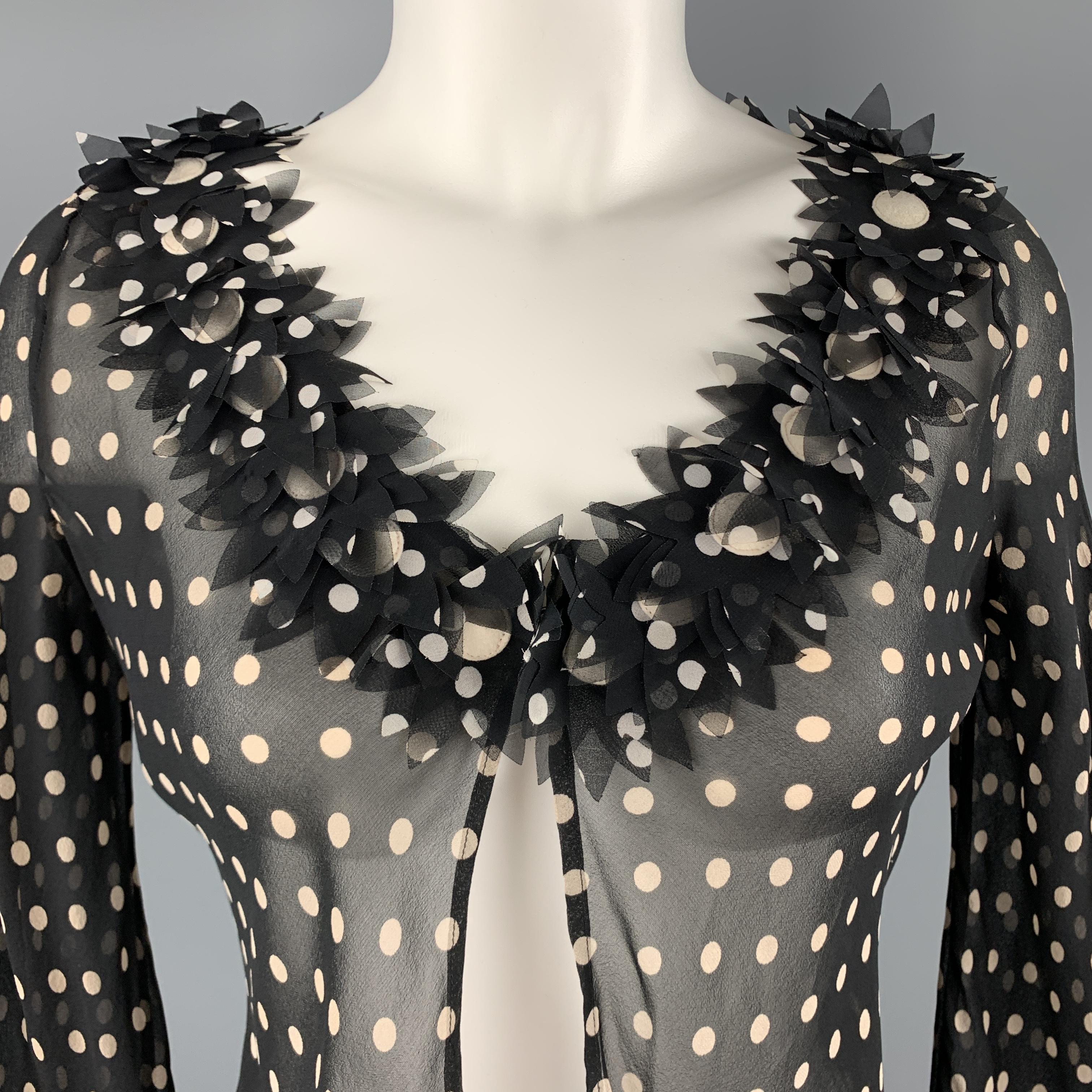 MOSCHINO CHEAP AND CHIC cardigan blouse comes in black an cream polka dot silk with a single hook closure, detailed with floral appliques. Matching camisole seperate. Made in Italy.

Excellent Pre-Owned Condition.
Marked: 8

Measurements:

Shoulder: