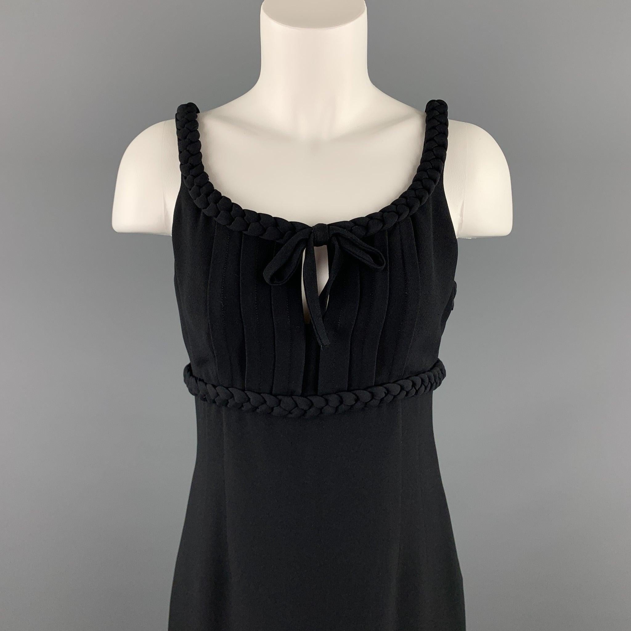 MOSCHINO cocktail dress comes in a black rayon / acetate featuring a empire waist style, braided detail, and a side zipper closure. Made in Italy.Excellent
 Pre-Owned Condition. 
 

 Marked:  US 8 
 

 Measurements: 
  Bust: 30 inches 
 Waist: 28