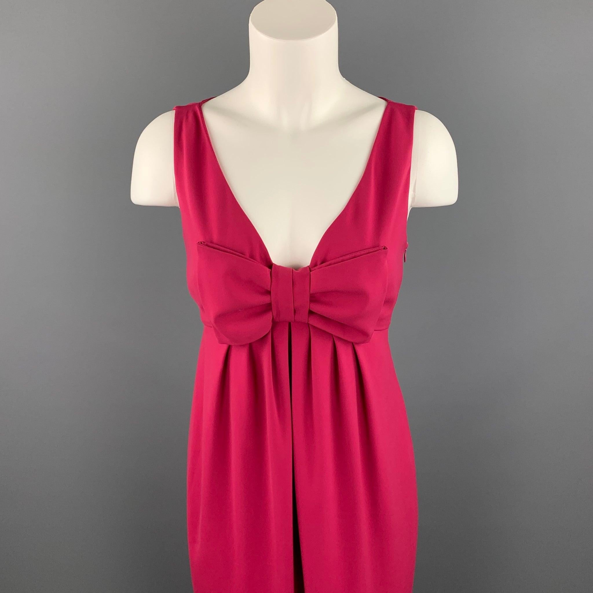MOSCHINO cocktail dress comes in a fuchsia polyester featuring an empire waist, v-neck, front bow detail, and a side zipper closure.Very Good
Pre-Owned Condition. 

Marked:  8 

Measurements: 
 
Shoulder: 12.5 inches 
Bust: 16 inches 
Waist: 29