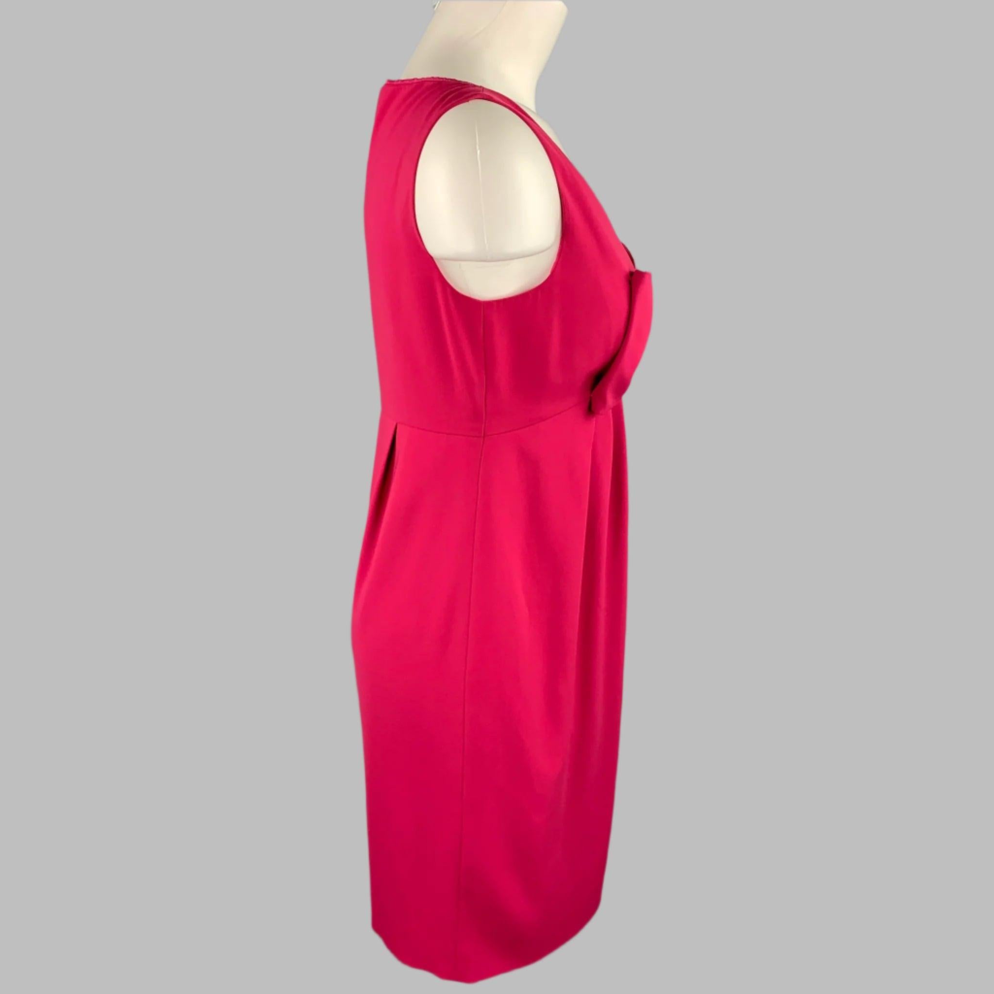 MOSCHINO cocktail dress in a fuchsia pink polyester featuring an empire waist, v-neck, front bow detail, and a side zipper closure.Very Good
Pre-Owned Condition. 

Marked:   8 

Measurements: 
 
Shoulder: 12.5 inches 
Bust: 16 inches 
Waist: 29