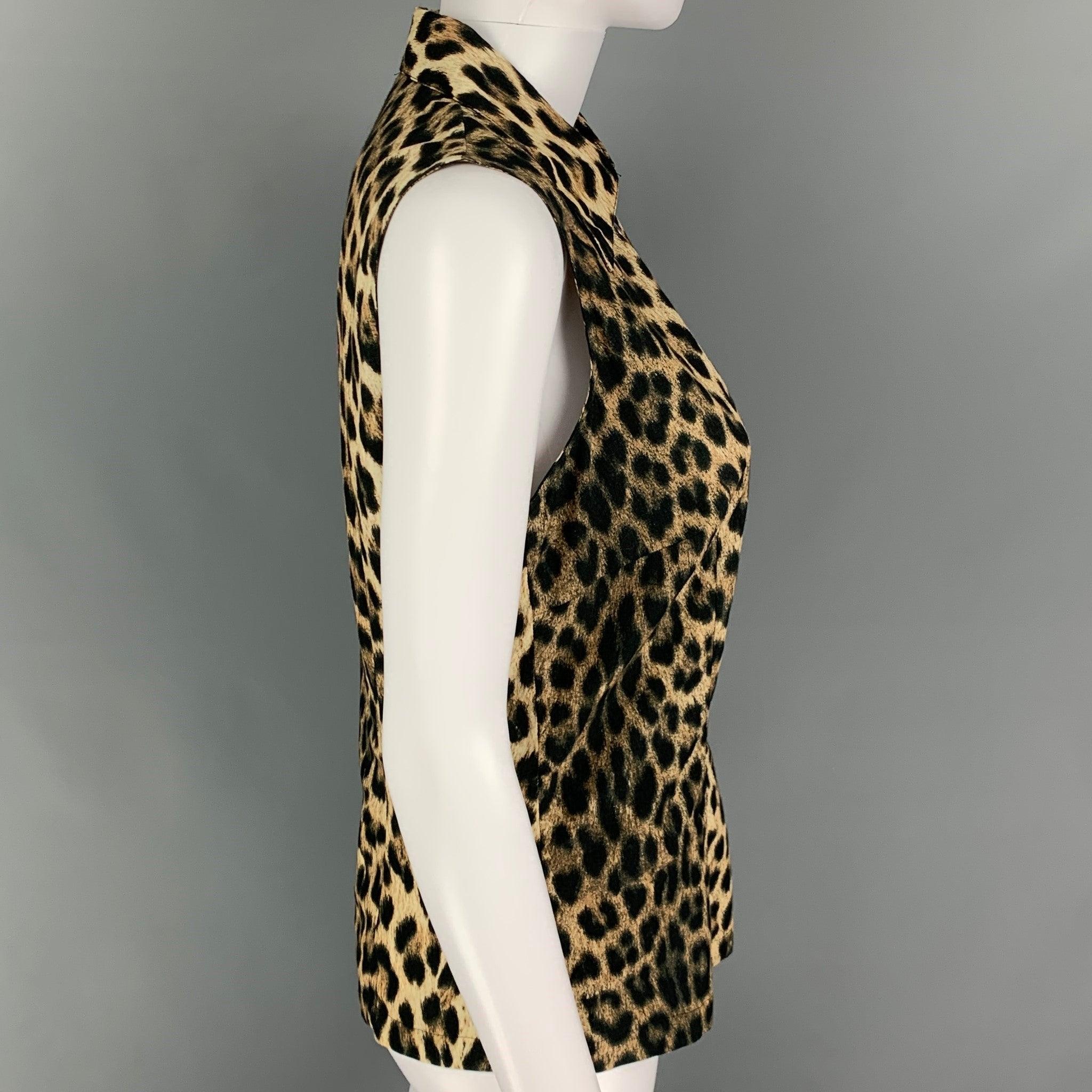 MOSCHINO top comes in a beige & brown animal print cotton featuring a sleeveless style, pointed collar, front grommets, and a v-neck.
 Very Good
 Pre-Owned Condition. 
 

 Marked:  I 40 / D 36 / F 38 / UK 32 / US 32/S 
 

 Measurements: 
  
