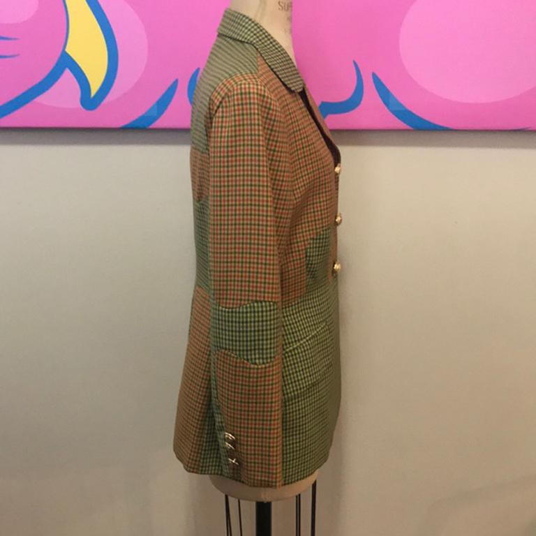 Moschino tan plaid puzzle jacket blazer

Rare and collectible puzzle jacket by Moschino Cheap and Chic - pair with brown or black skinny pants and boots for a great fall look Vintage perfection!
Size 6
Across chest - 19 1/2 in.
Across waist - 16