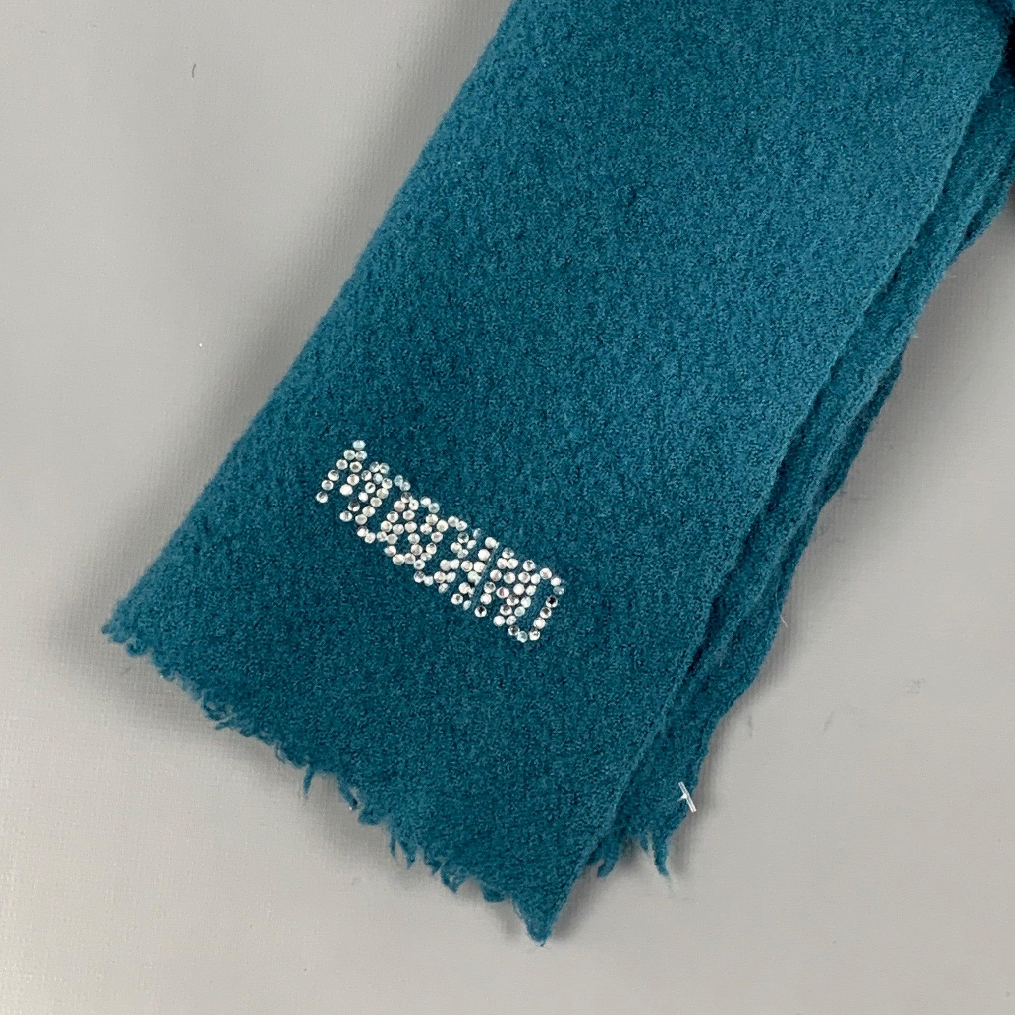 MOSCHINO scarf comes in a teal material featuring a logo rhinestone design. Made in Italy.Good
Pre-Owned Condition. 

Measurements: 
  60 inches  x 22 inches 
  
  
 
Reference: 121411
Category: Scarves & Shawls
More Details
    
Brand: 