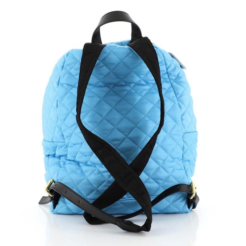 blue quilted backpack