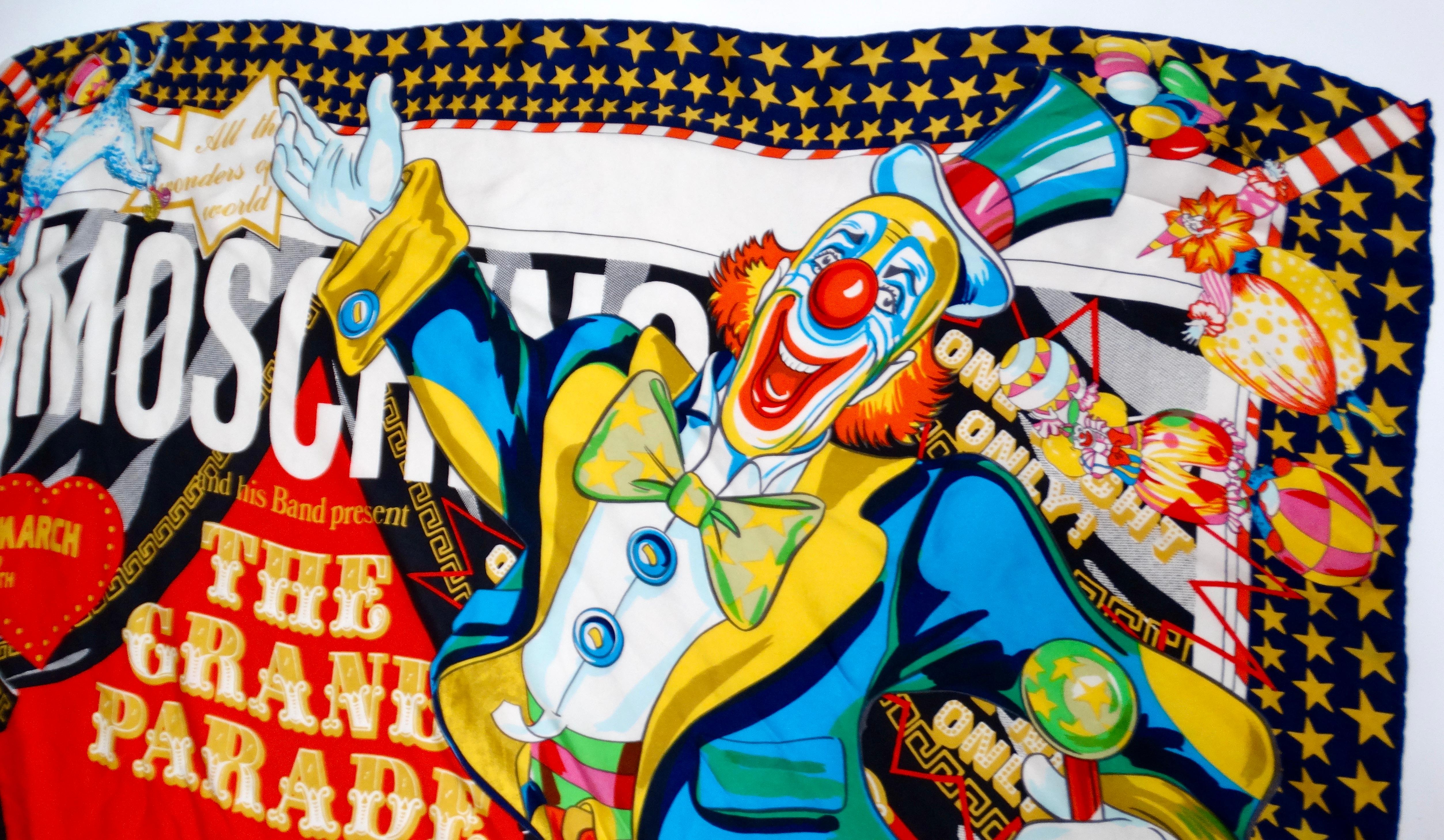 The Moschino The Grand Parade Colorful Circus Print Silk Scarf is a vibrant celebration of whimsy and artistry, capturing the enchanting spirit of the circus. Featuring a playful clown print at the forefront, this piece is adorned with a multitude